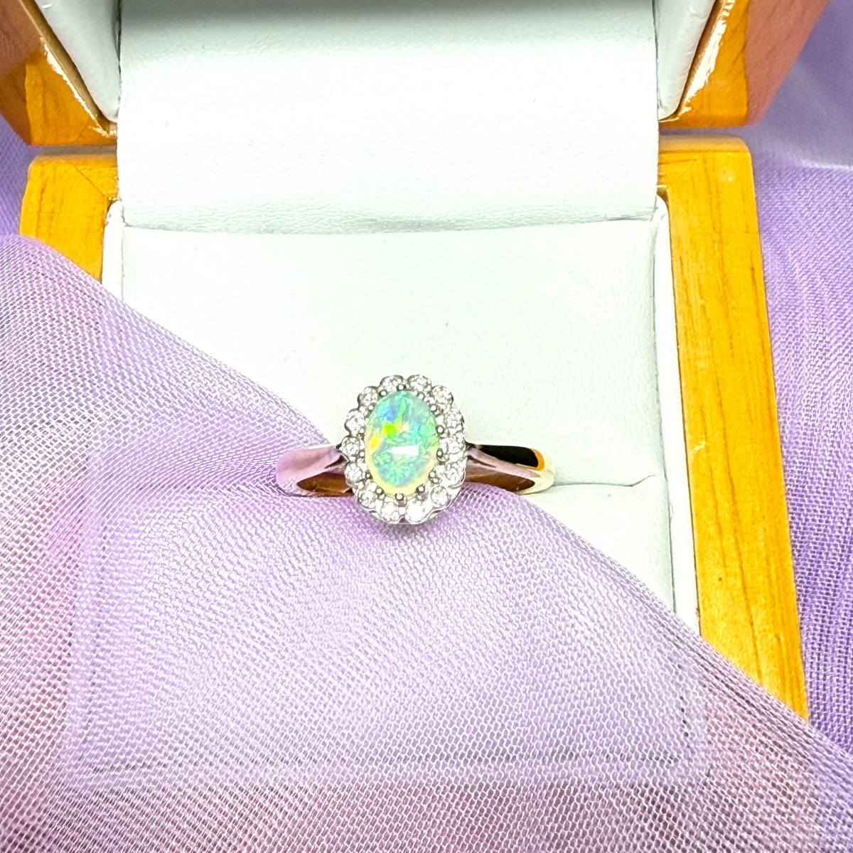 Real oval opal and diamond yellow gold cluster ring