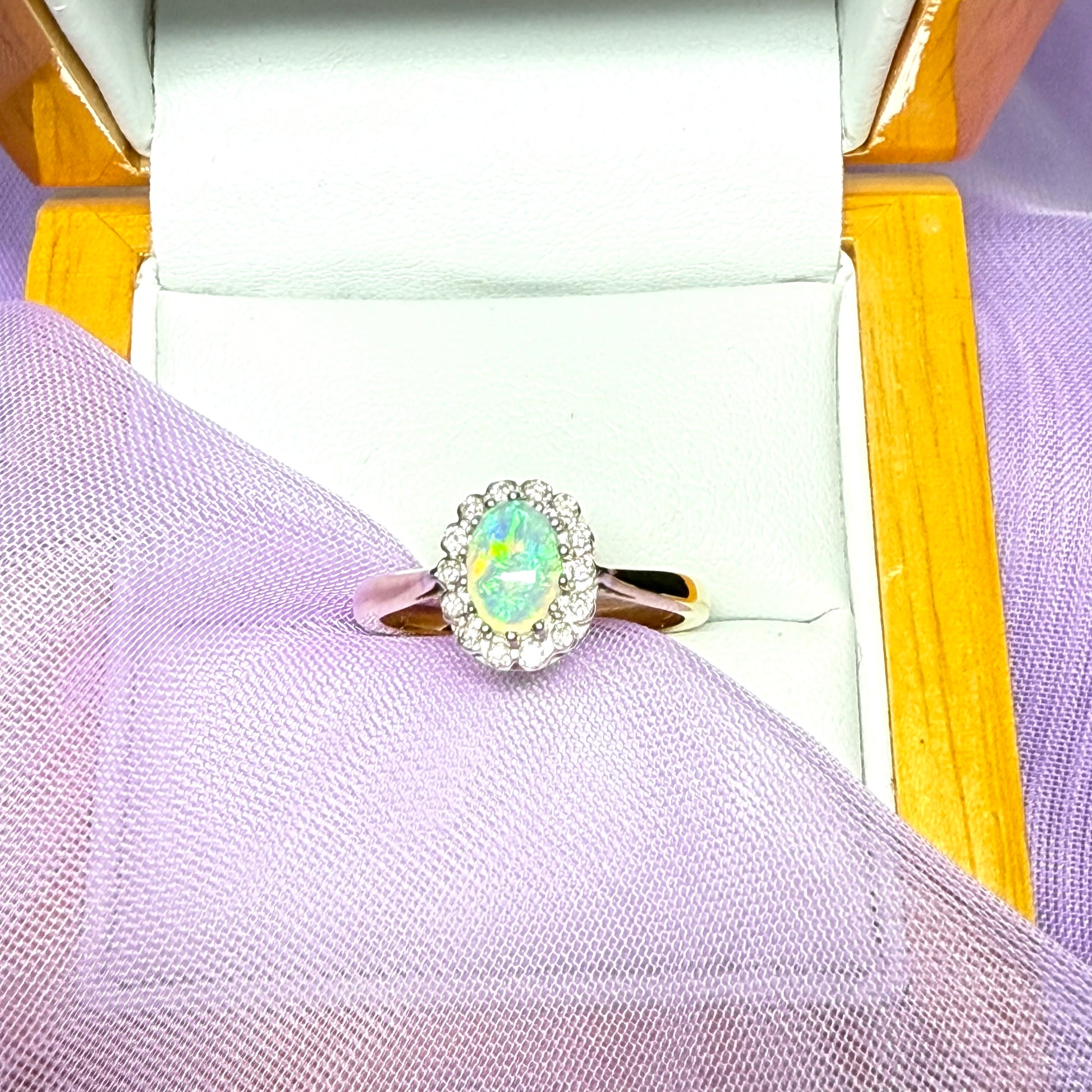 Real oval opal and diamond yellow gold cluster ring