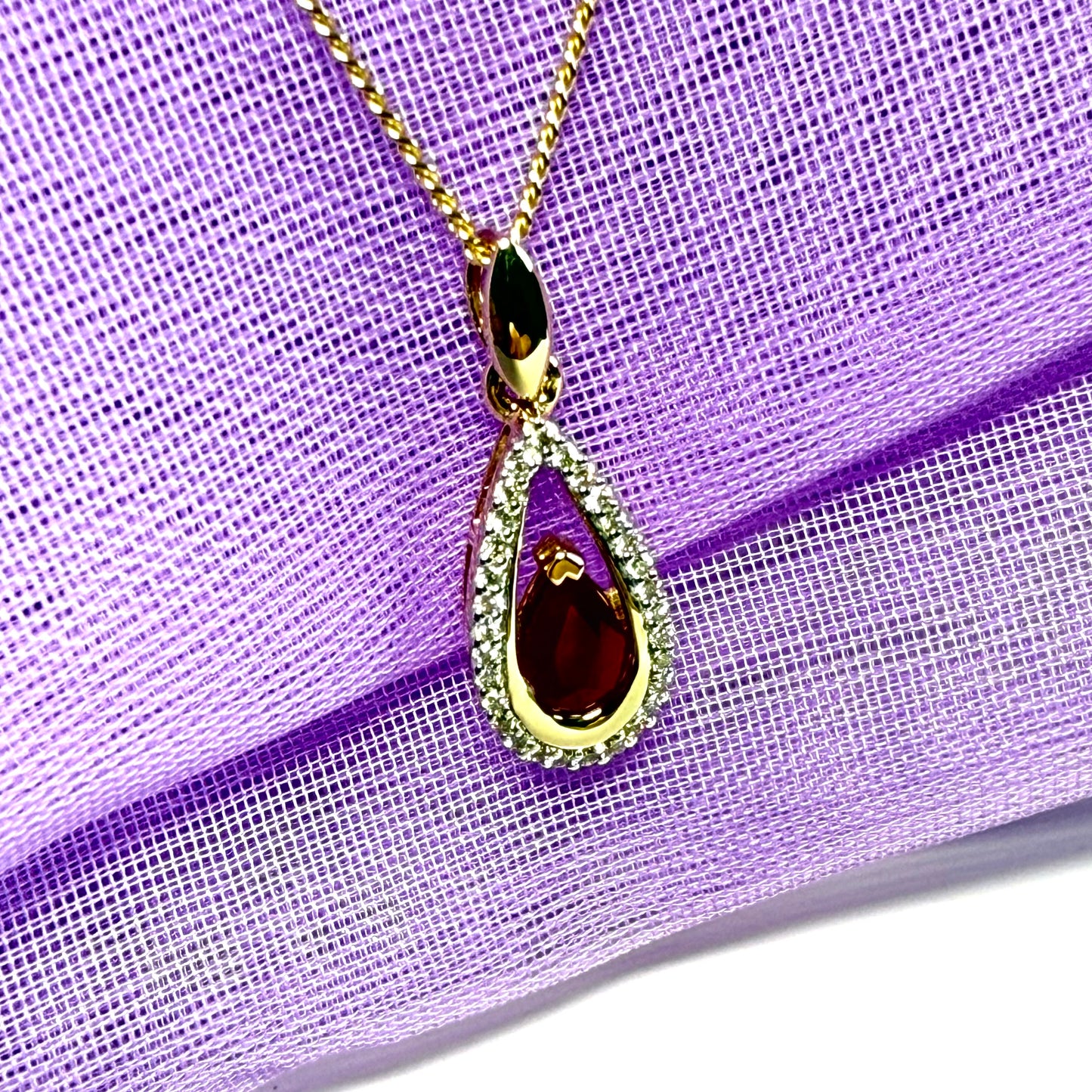 Real red pear shaped ruby and diamond pierced necklace yellow gold