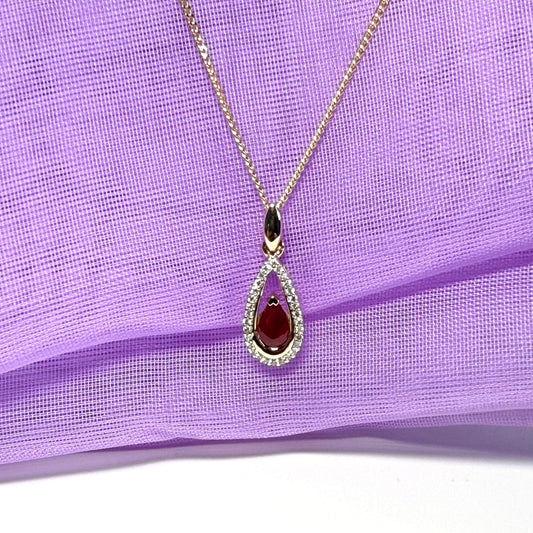 Real red pear shaped ruby and diamond pierced necklace yellow gold