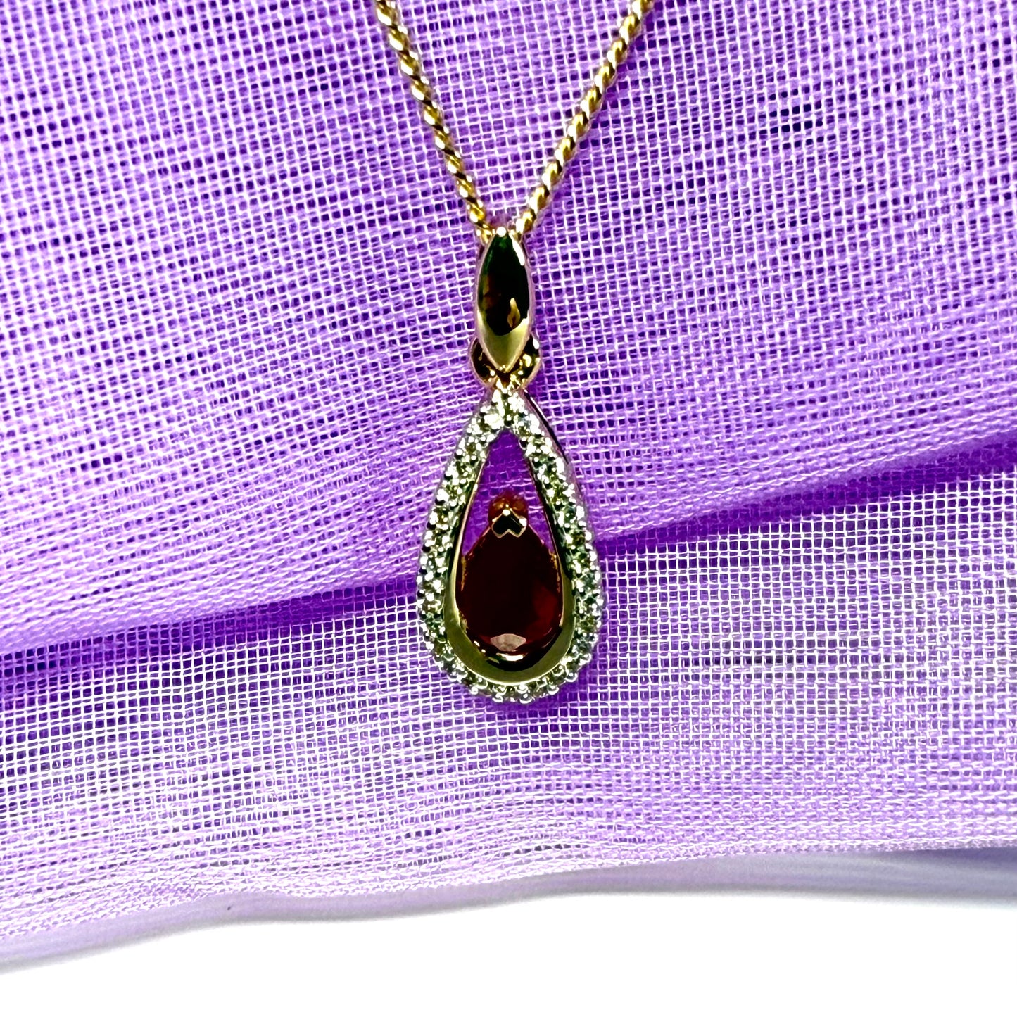 Real red pear shaped ruby and diamond pierced necklace yellow gold