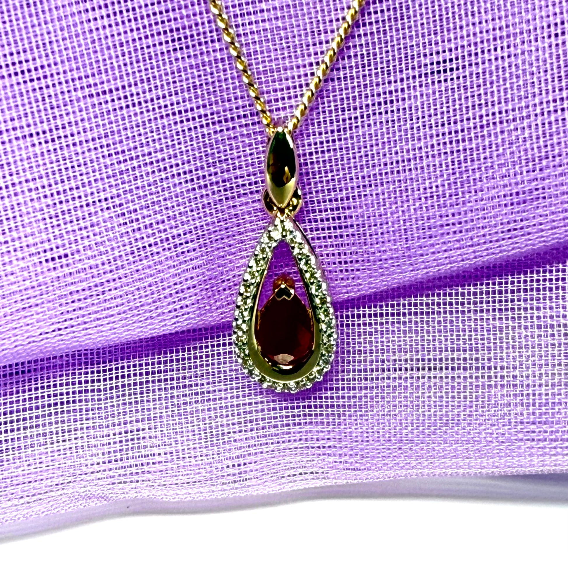 Real red pear shaped ruby and diamond pierced necklace yellow gold