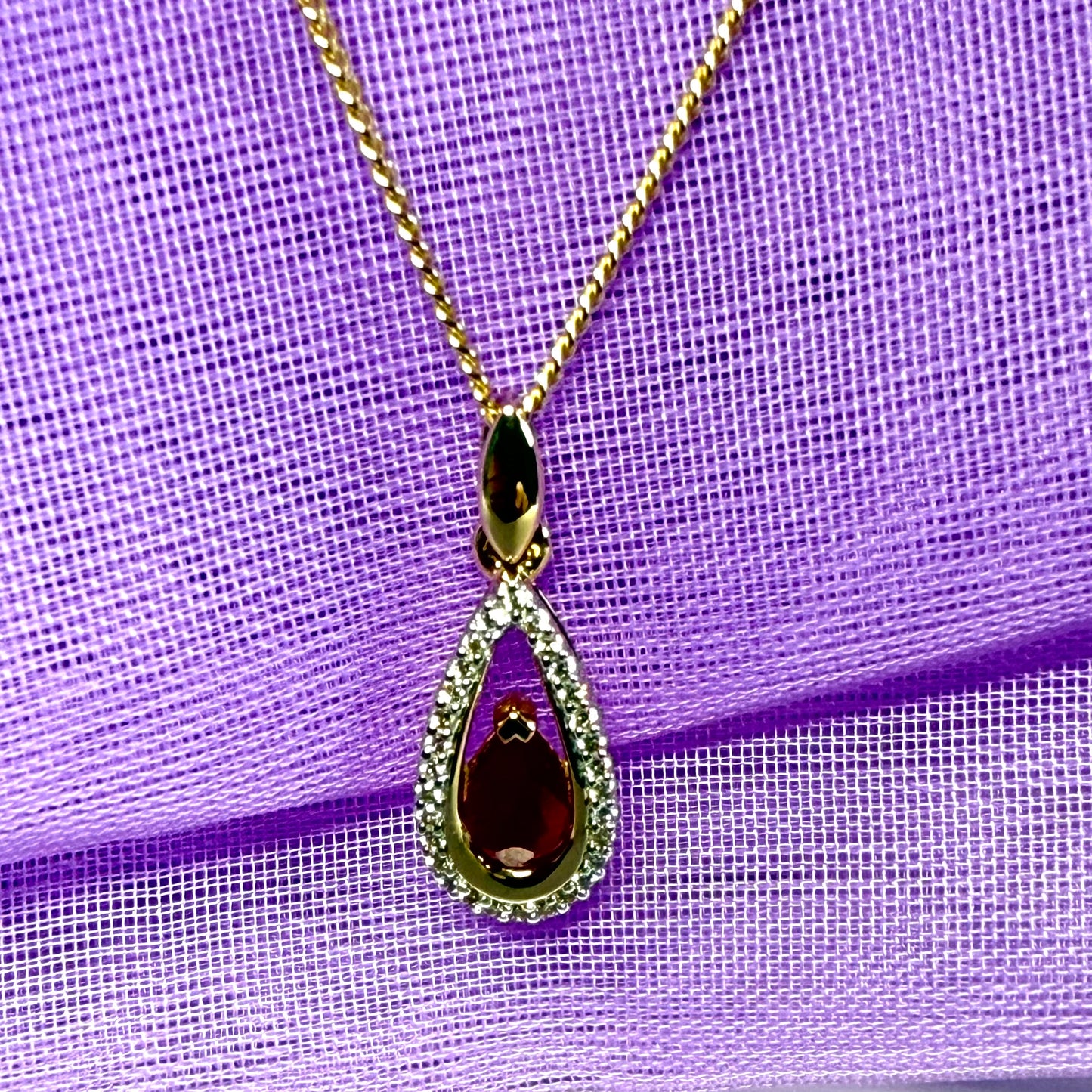 Real red pear shaped ruby and diamond pierced necklace yellow gold