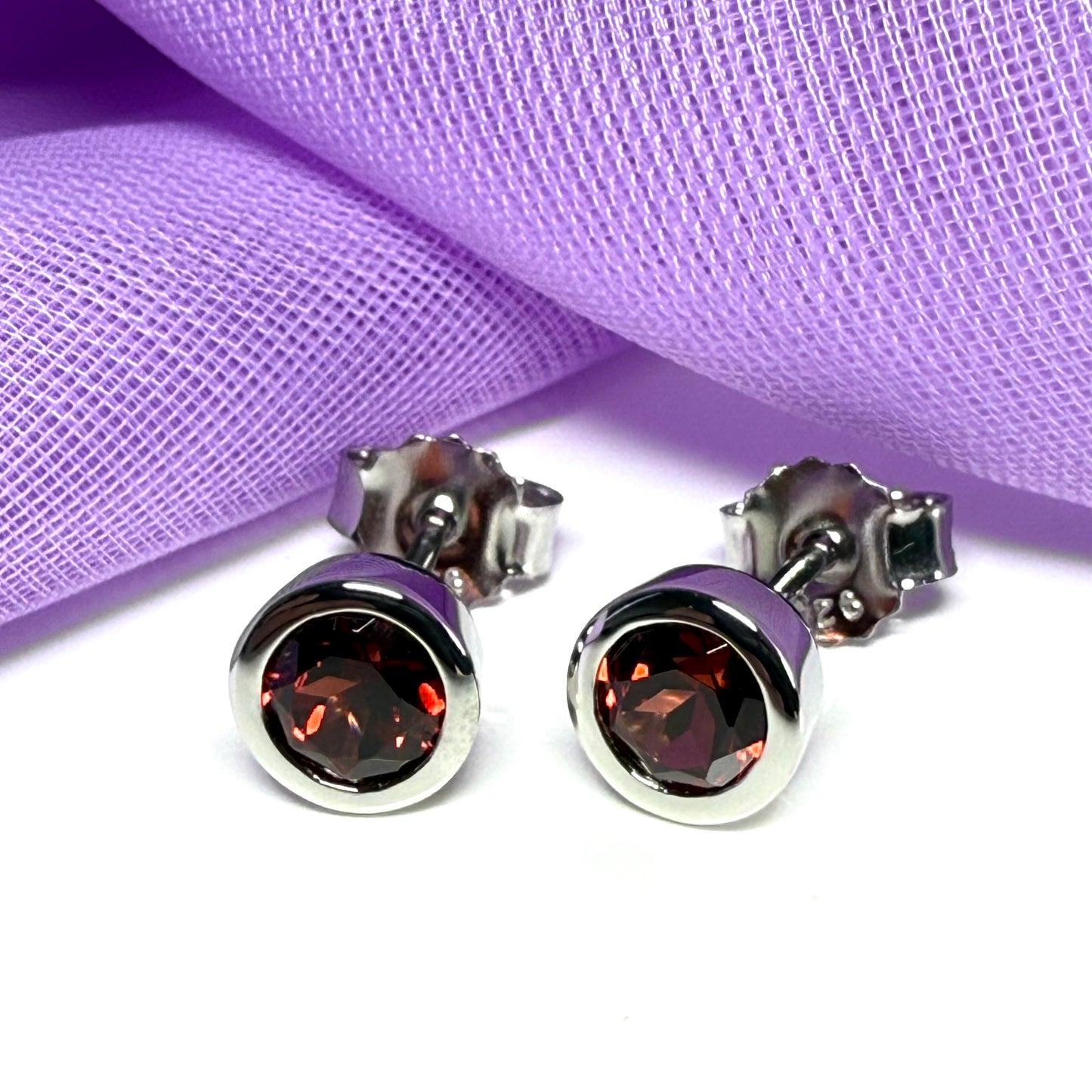 Real red round garnet stud earrings smooth rubbed over edges