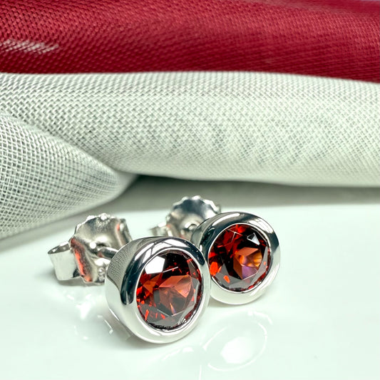 Real red round garnet stud earrings smooth rubbed over edges