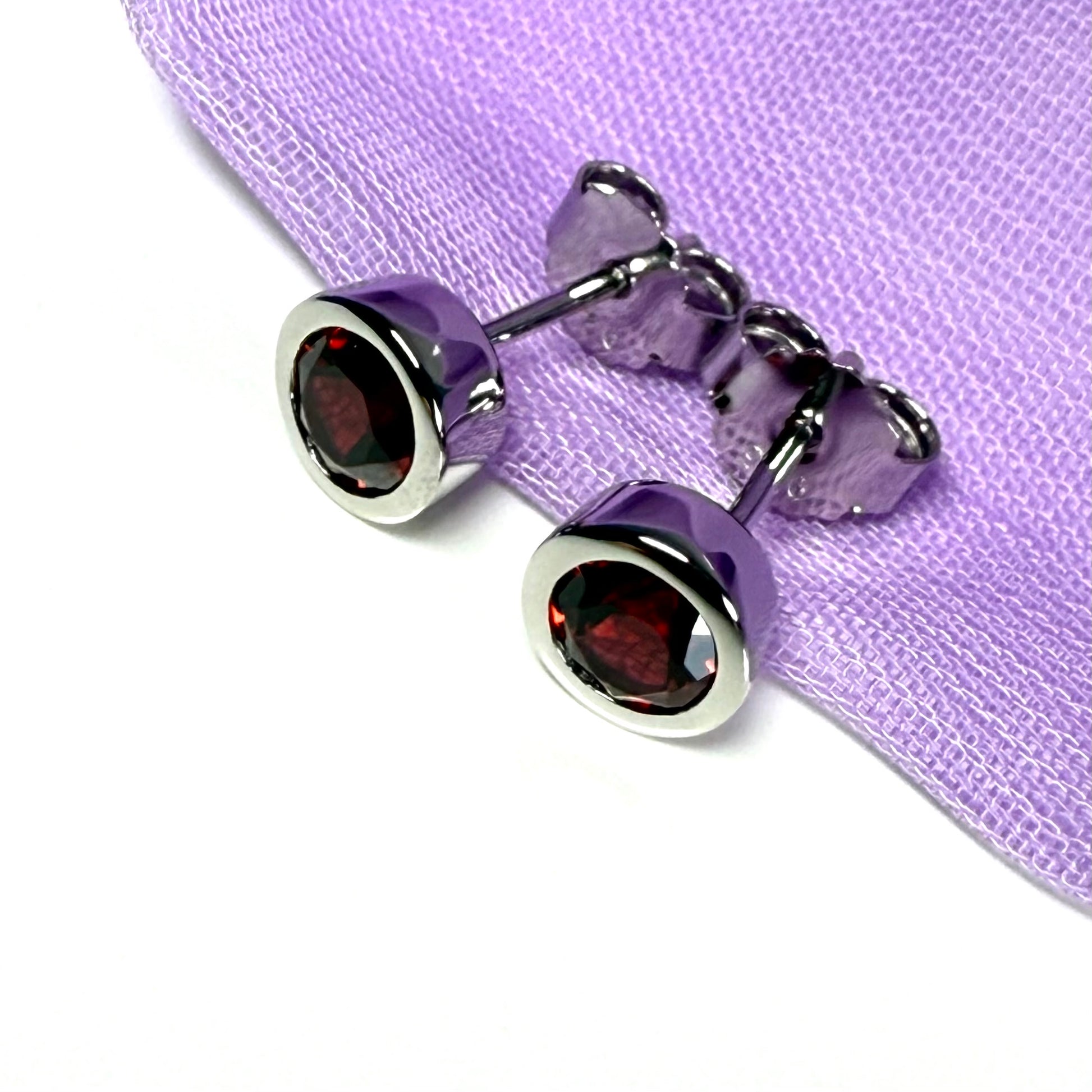 Real red round garnet stud earrings smooth rubbed over edges