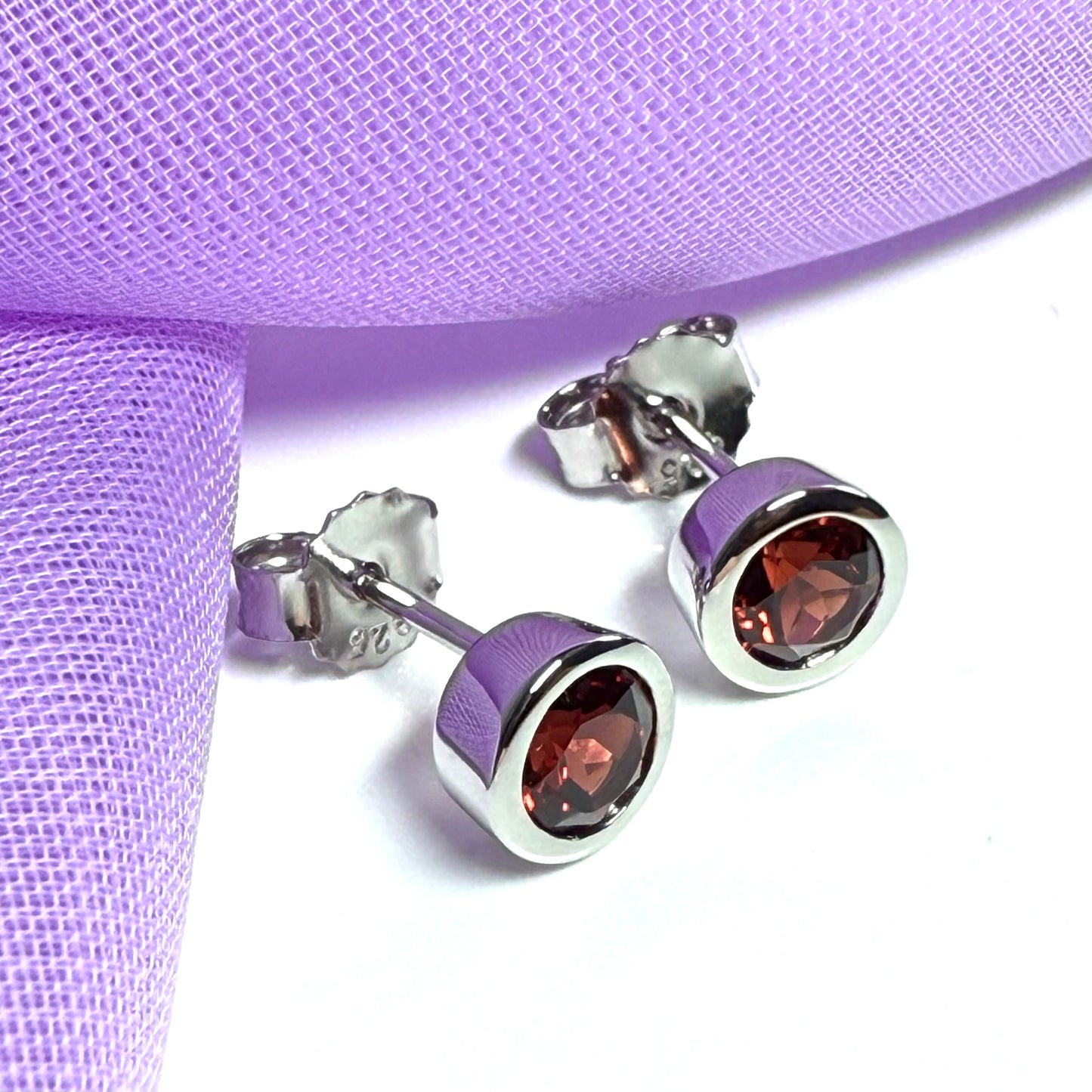 Real red round garnet stud earrings smooth rubbed over edges