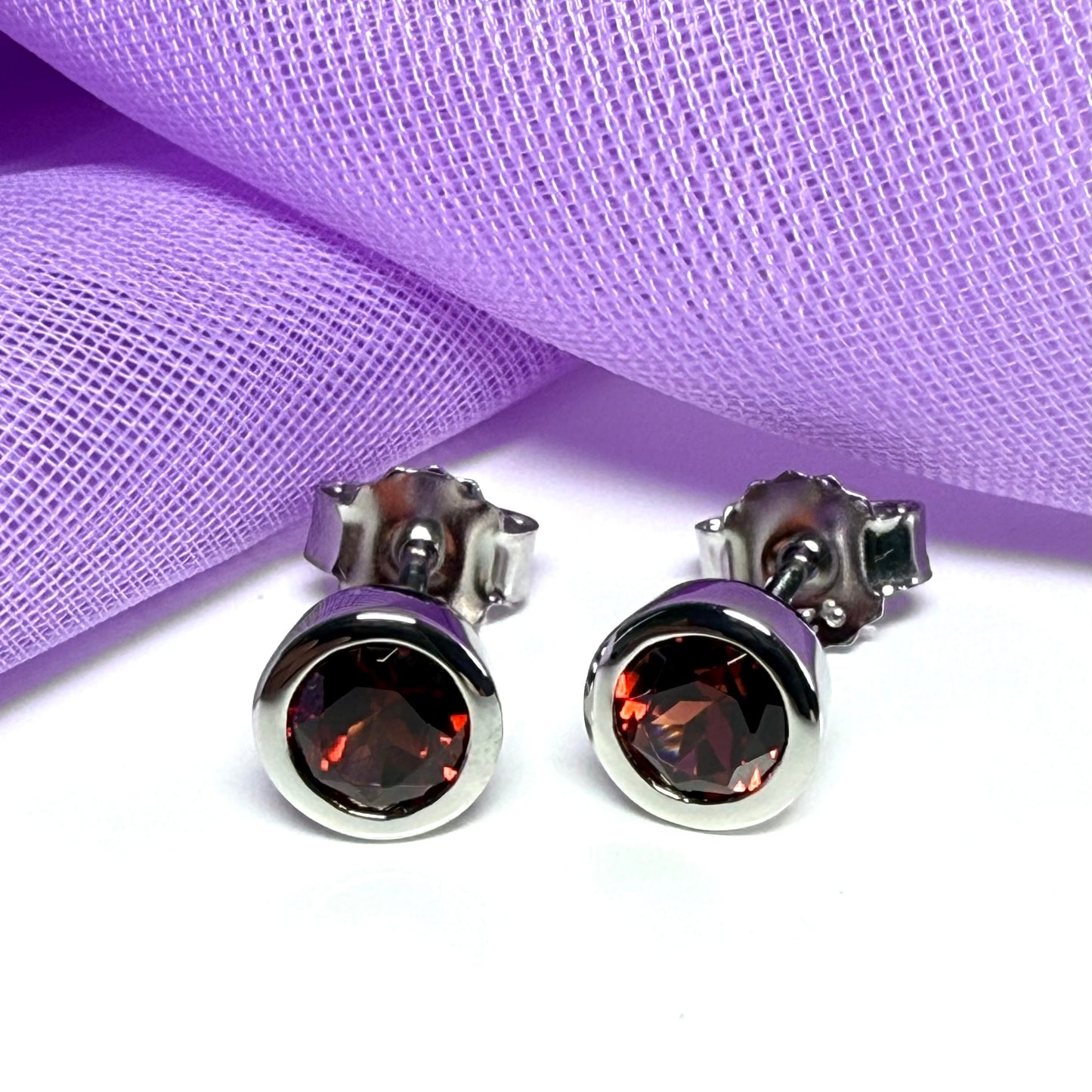 Real red round garnet stud earrings smooth rubbed over edges