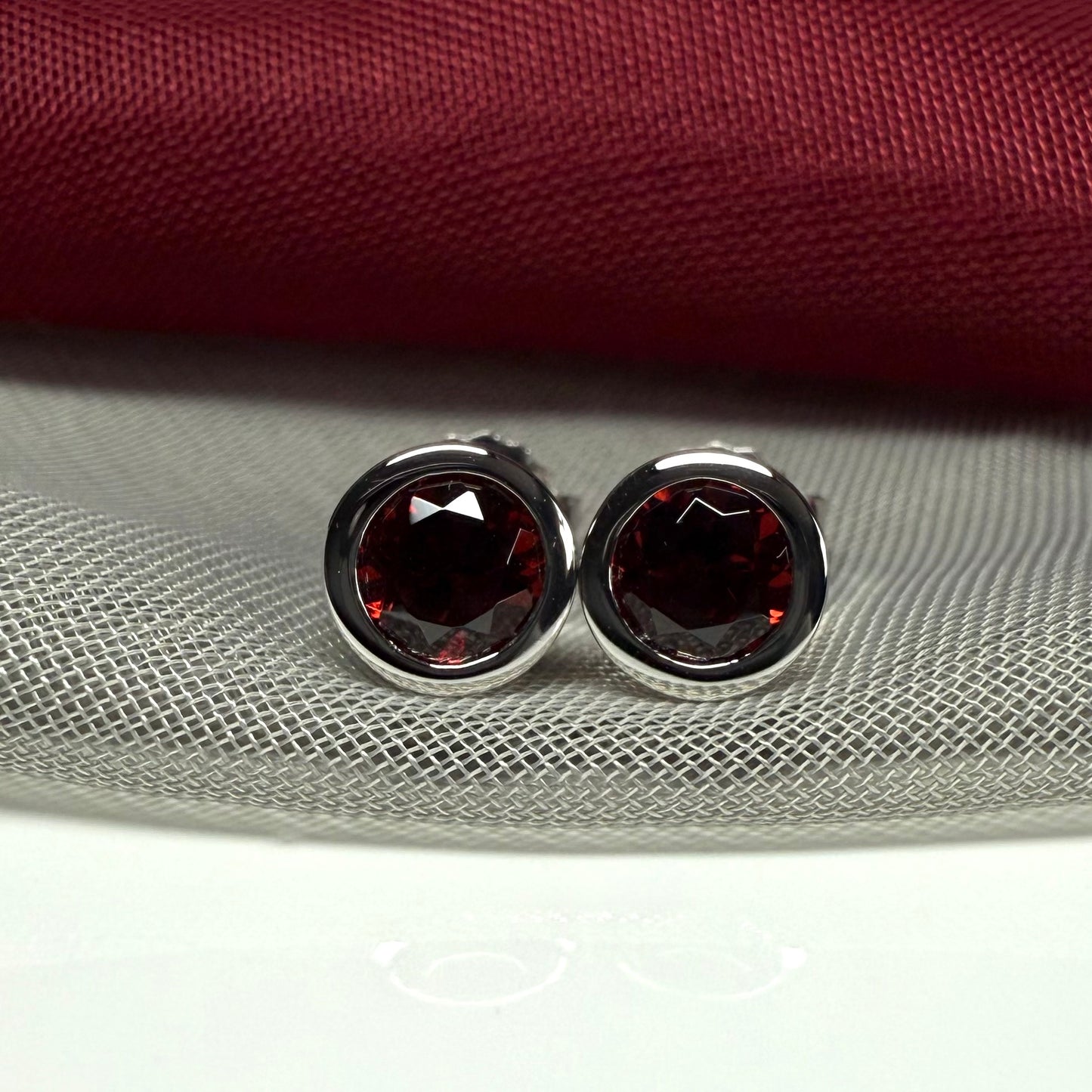 Real red round garnet stud earrings smooth rubbed over edges