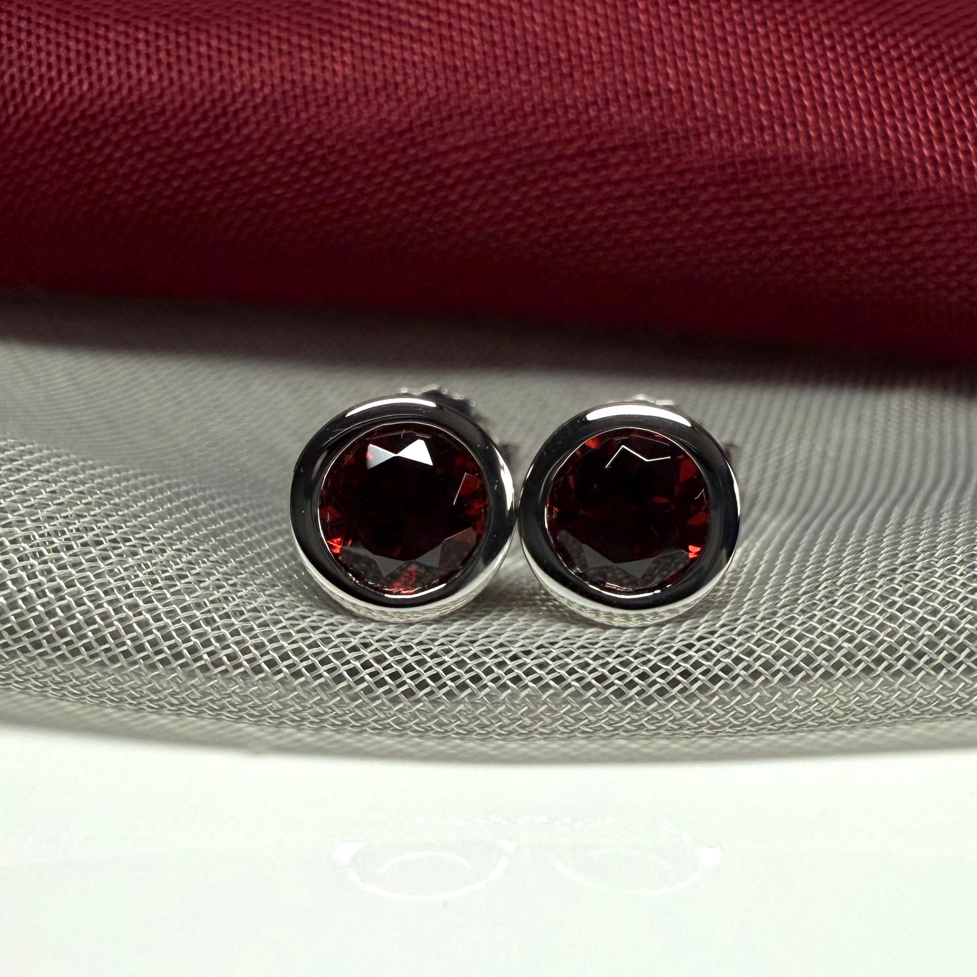 Real red round garnet stud earrings smooth rubbed over edges