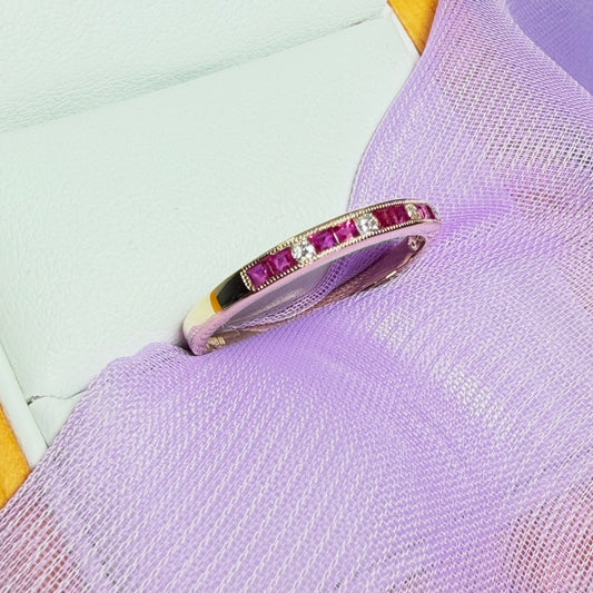 Real red ruby and diamond channel set eternity ring yellow gold
