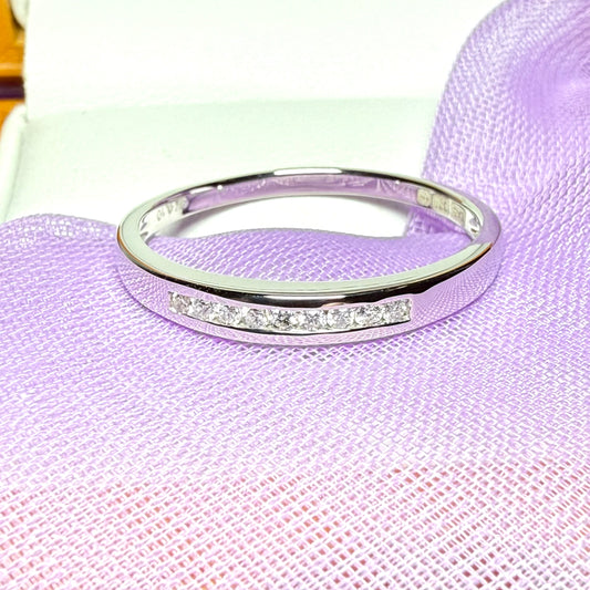 Real round cut diamond channel set eternity ring 10 points white gold