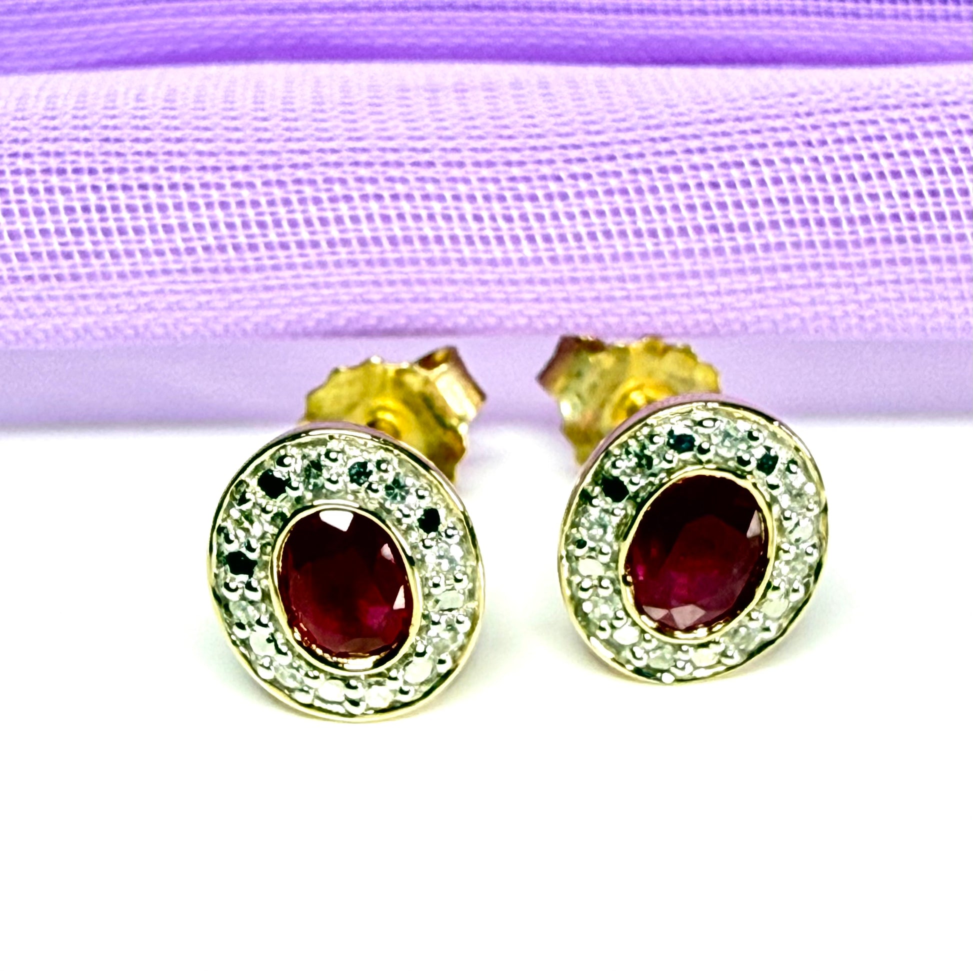 Real ruby and diamond oval shaped cluster stud earrings yellow gold