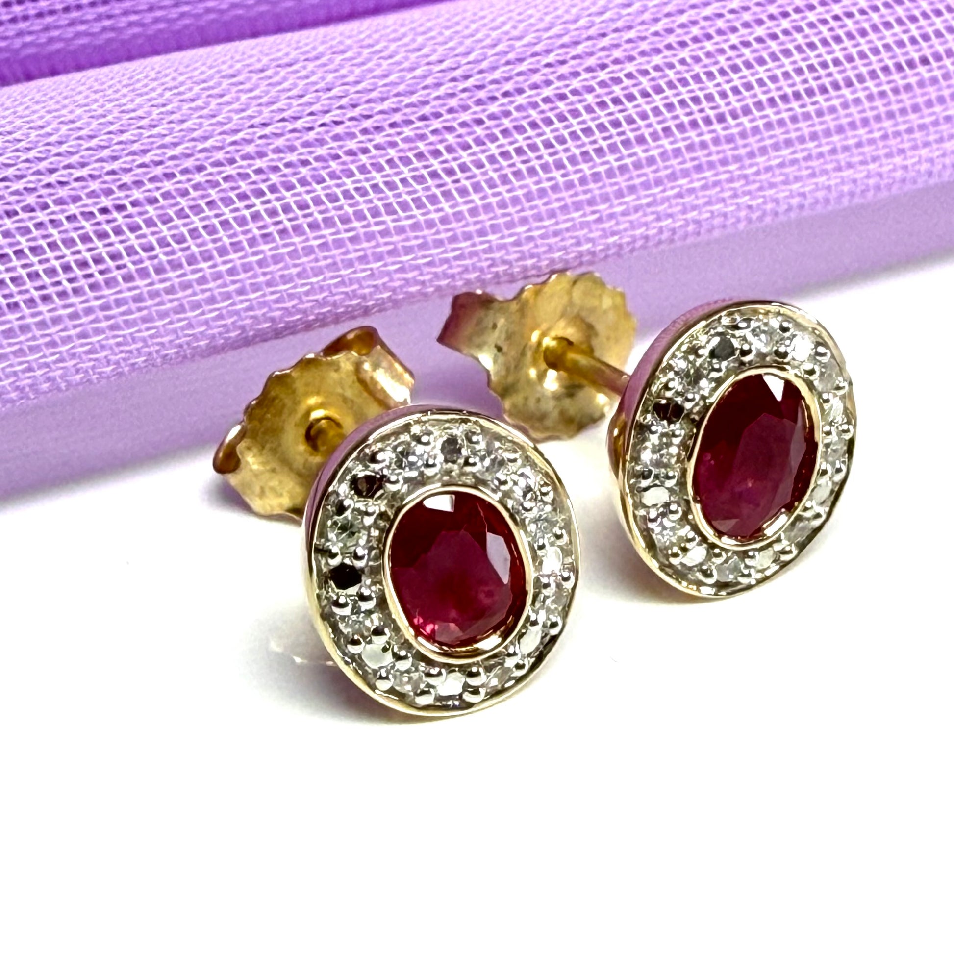 Real ruby and diamond oval shaped cluster stud earrings yellow gold