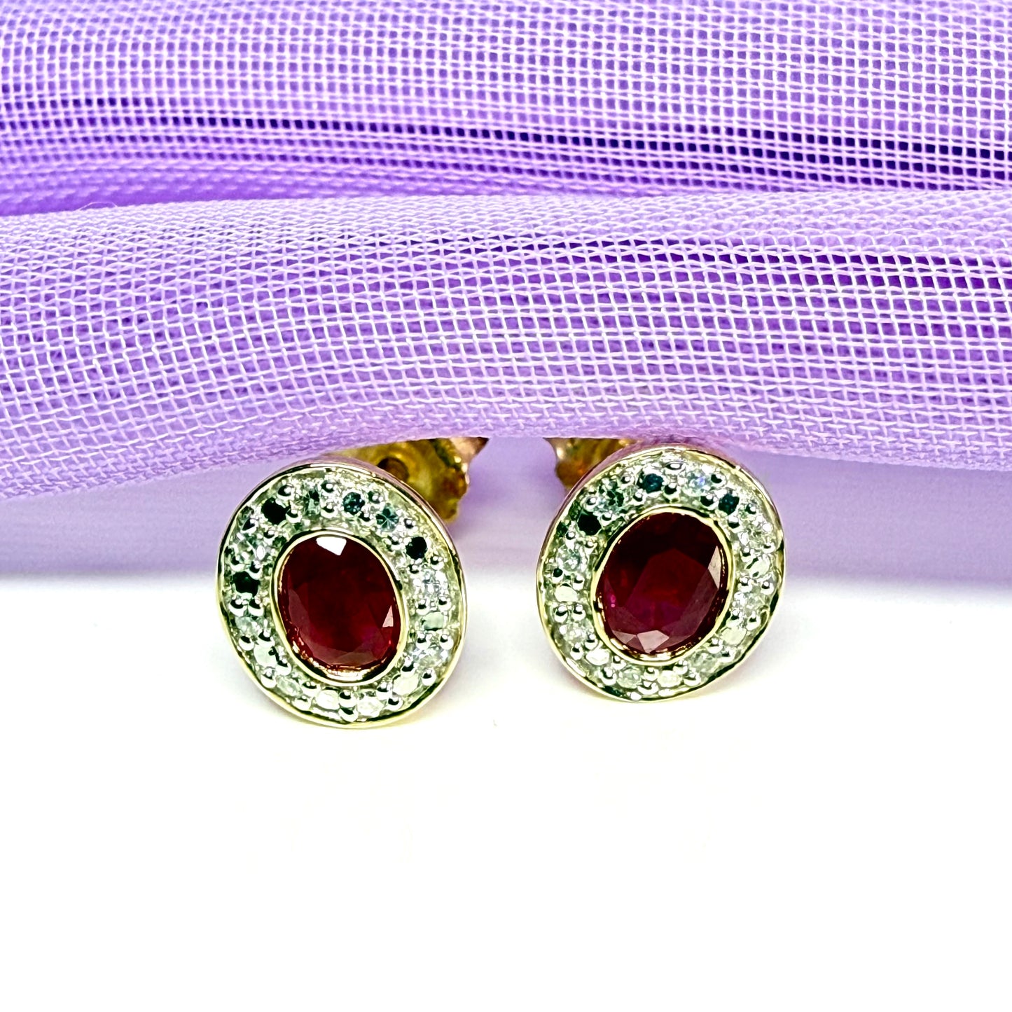 Real ruby and diamond oval shaped cluster stud earrings yellow gold