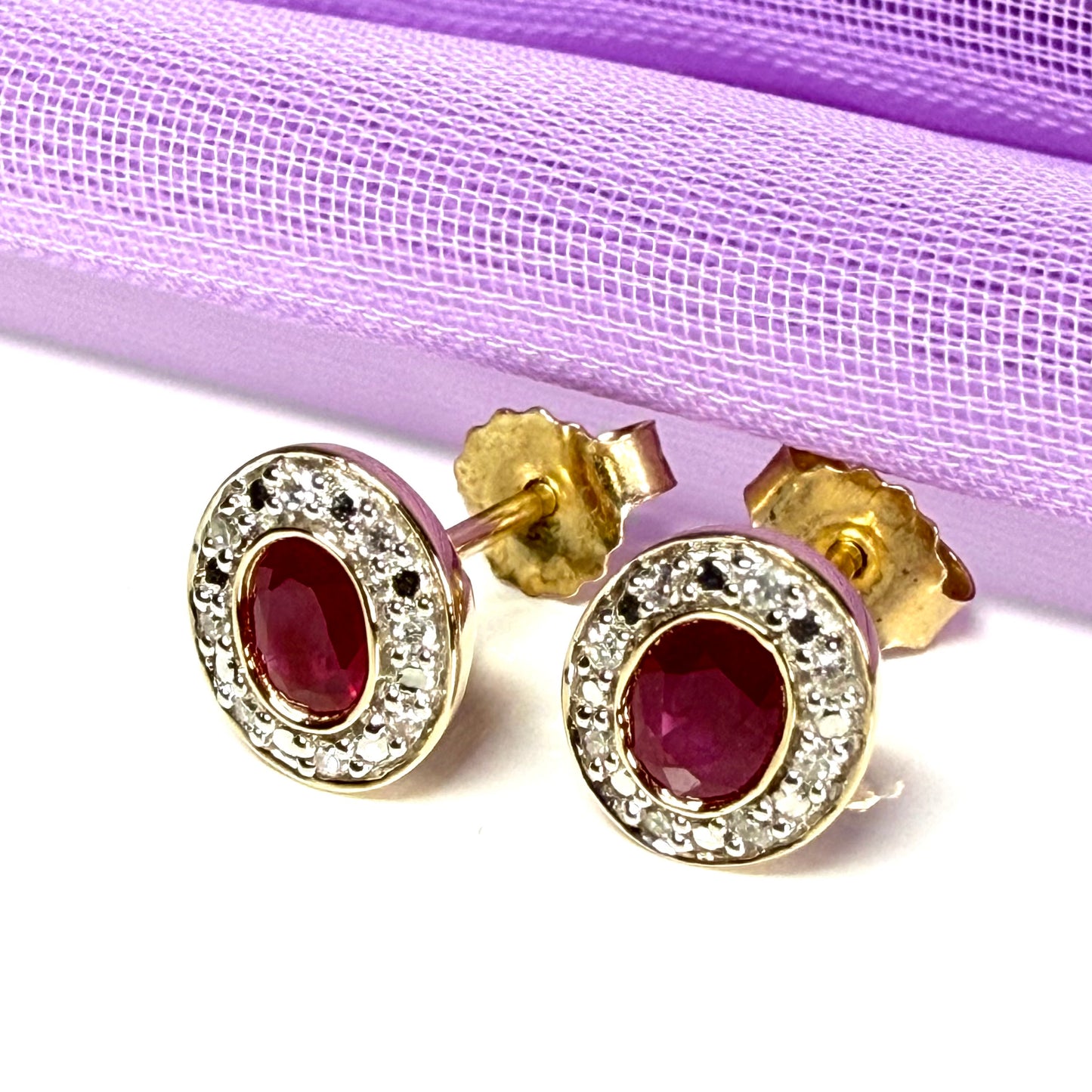Real ruby and diamond oval shaped cluster stud earrings yellow gold