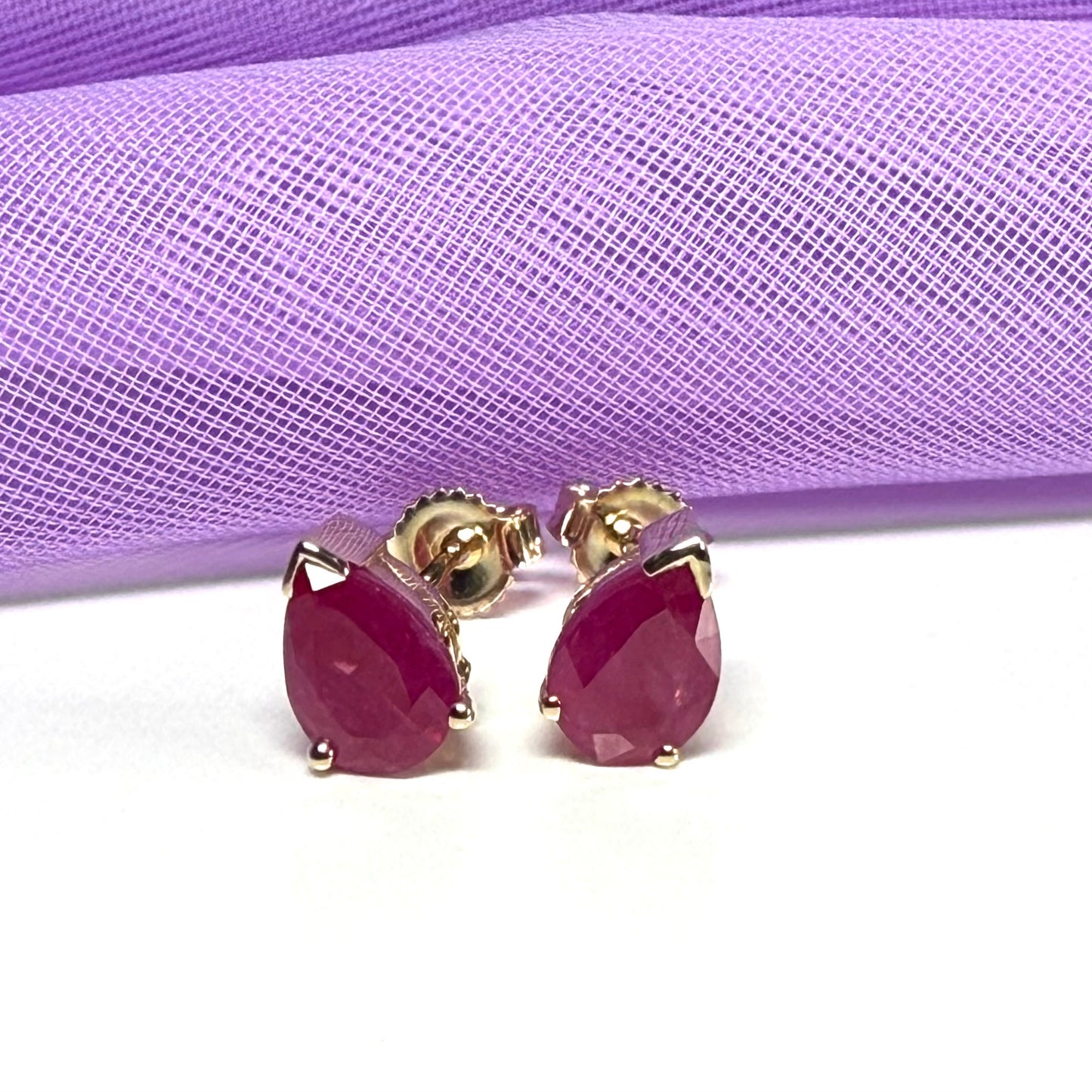 Real ruby yellow gold pear shaped stud earrings