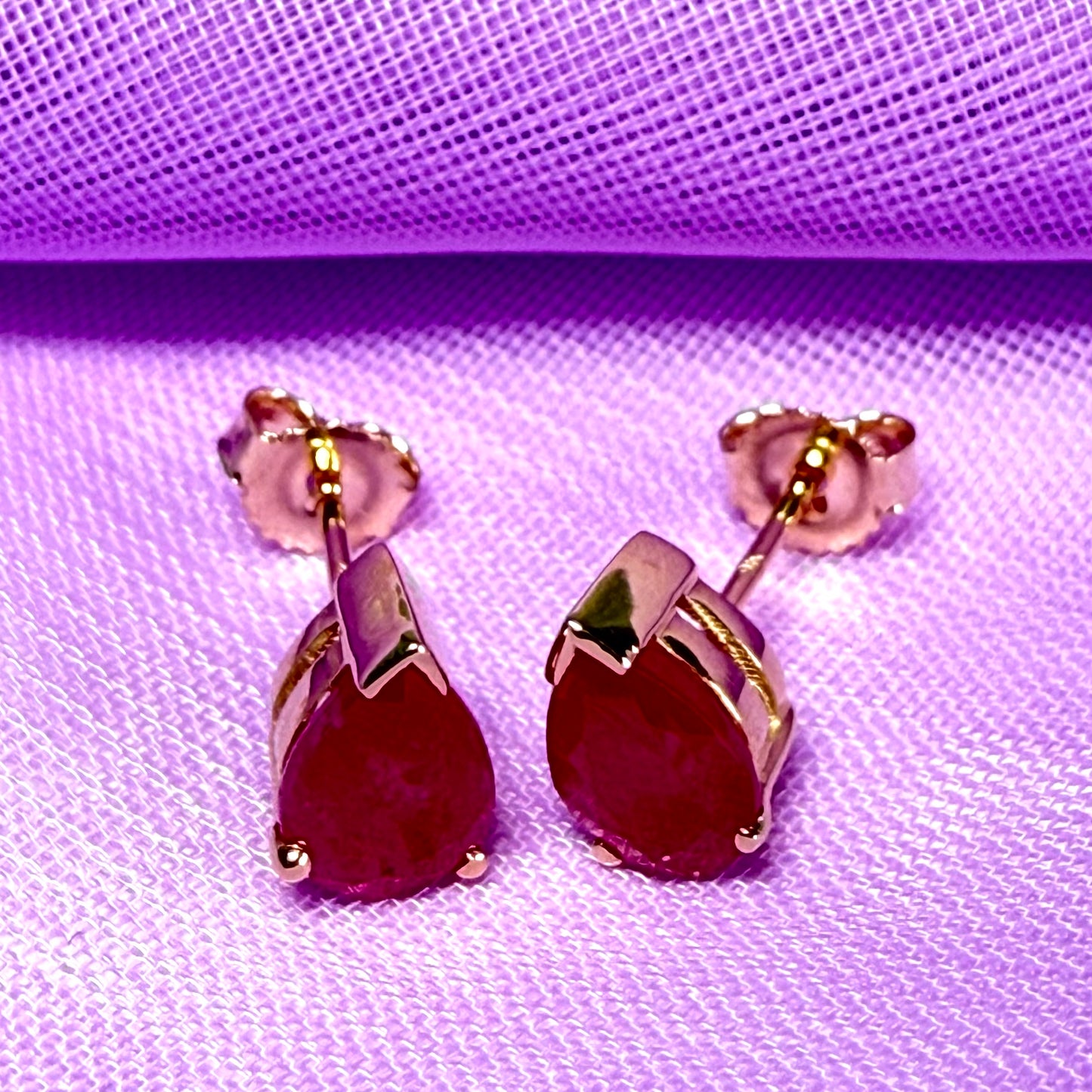 Real ruby yellow gold pear shaped stud earrings