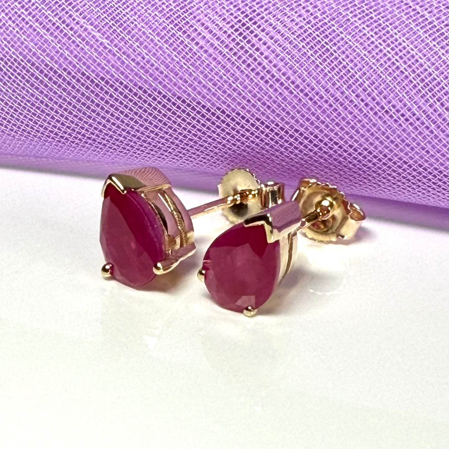 Real ruby yellow gold pear shaped stud earrings
