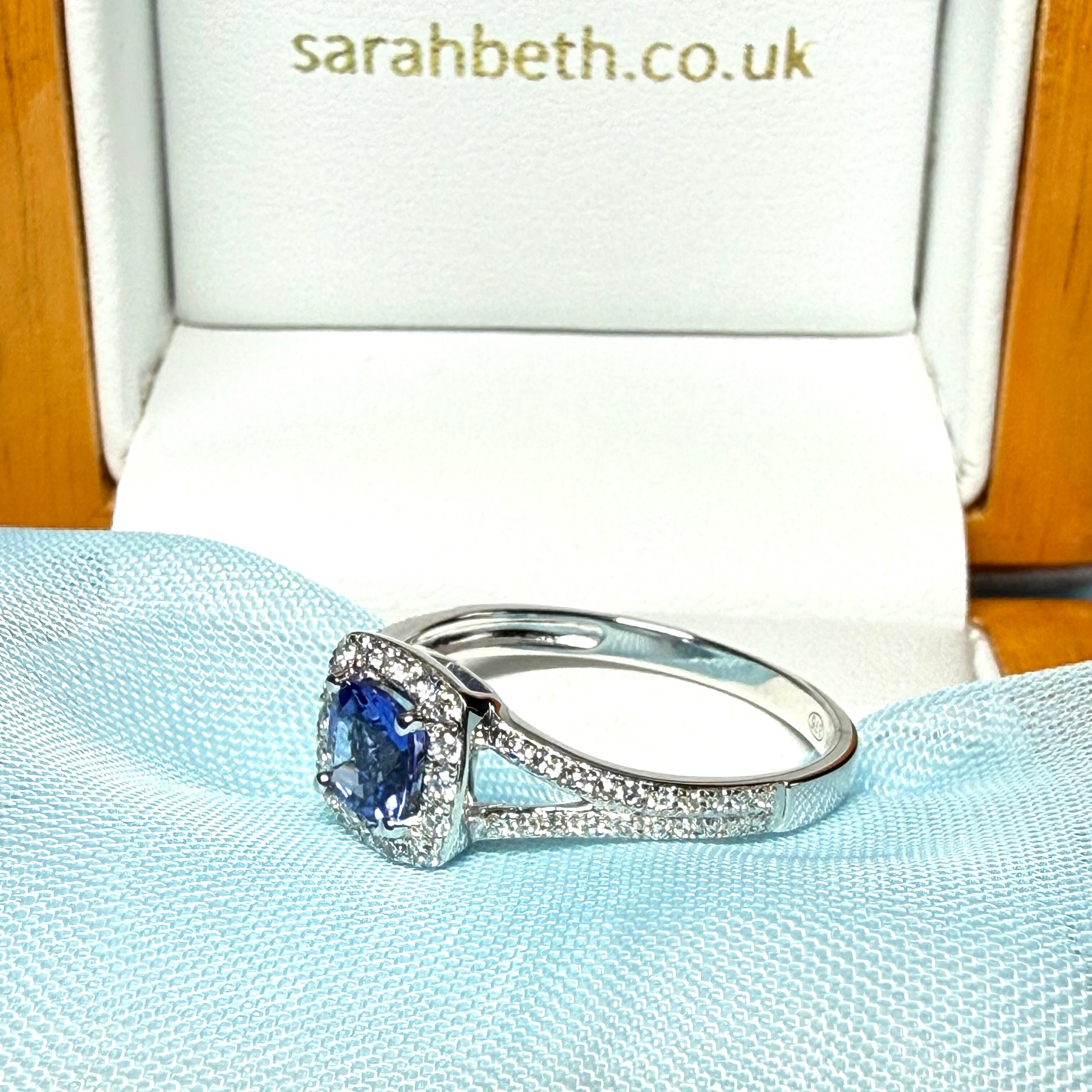 Real tanzanite and diamond white gold square cluster ring split shoulders cushion shape