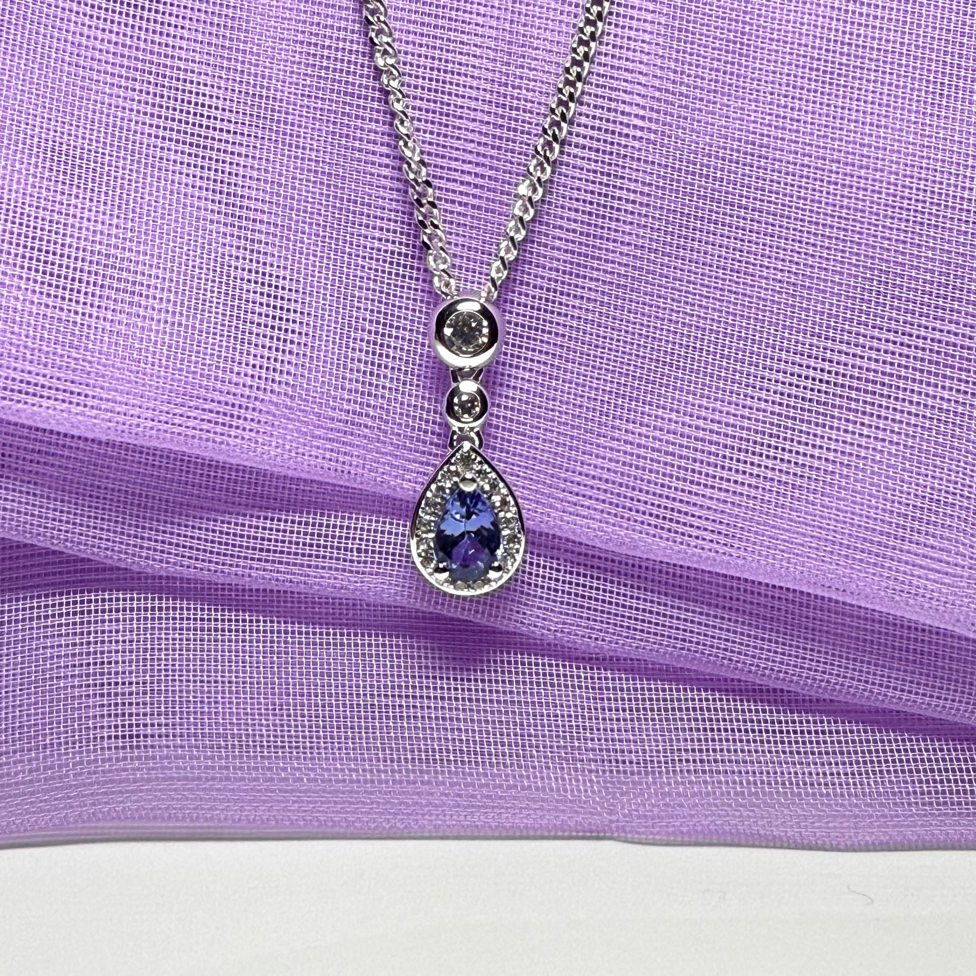 Real tanzanite and real diamond pear shaped necklace sterling silver pendant with a chain included