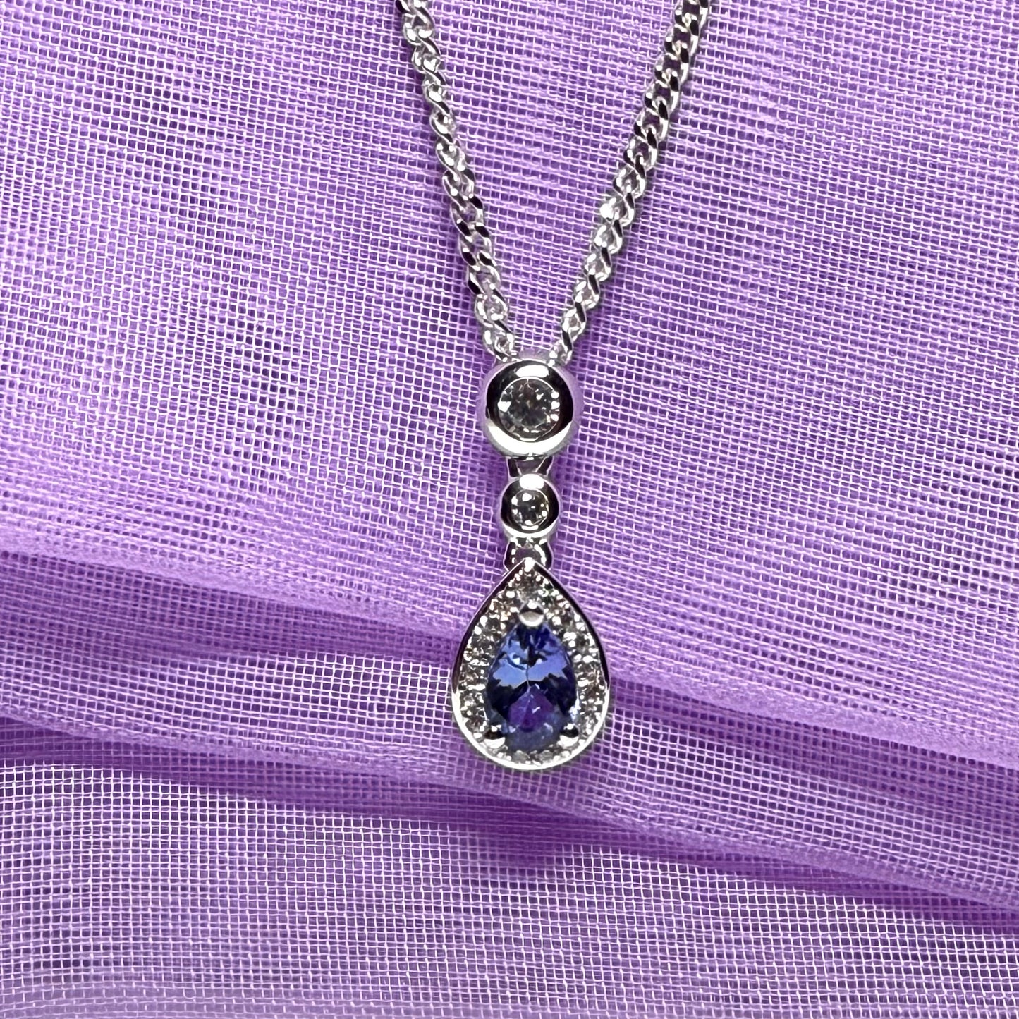 Real tanzanite and real diamond pear shaped necklace sterling silver pendant with a chain included