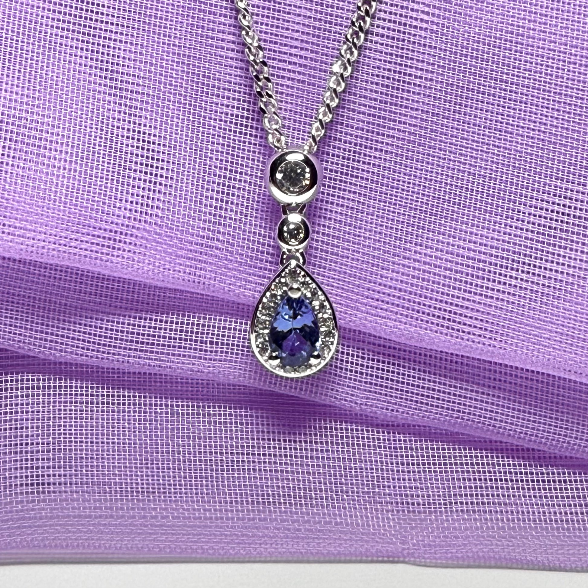 Real tanzanite and real diamond pear shaped necklace sterling silver pendant with a chain included