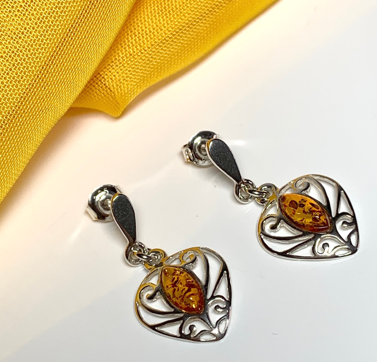 Heart shaped real amber drop earrings made in sterling silver