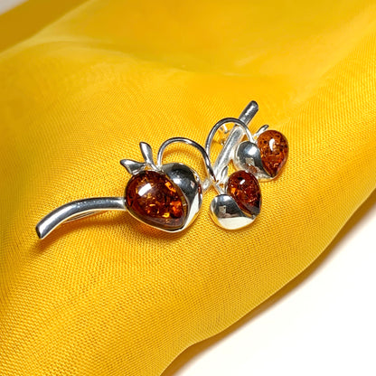 Real amber triple heart shaped and sterling silver brooch