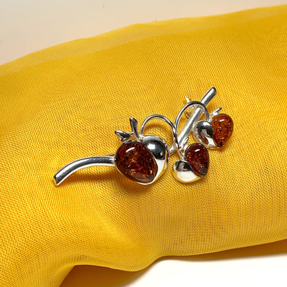 Real amber triple heart shaped and sterling silver brooch