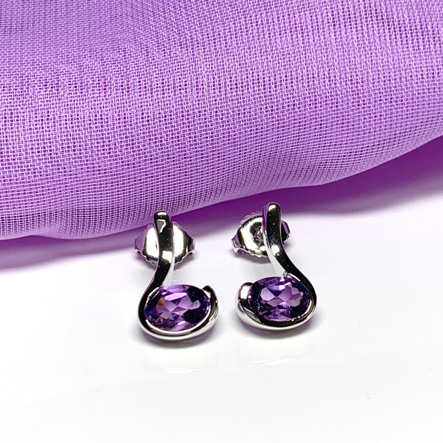 Real amethyst earrings fancy purple stud swirl