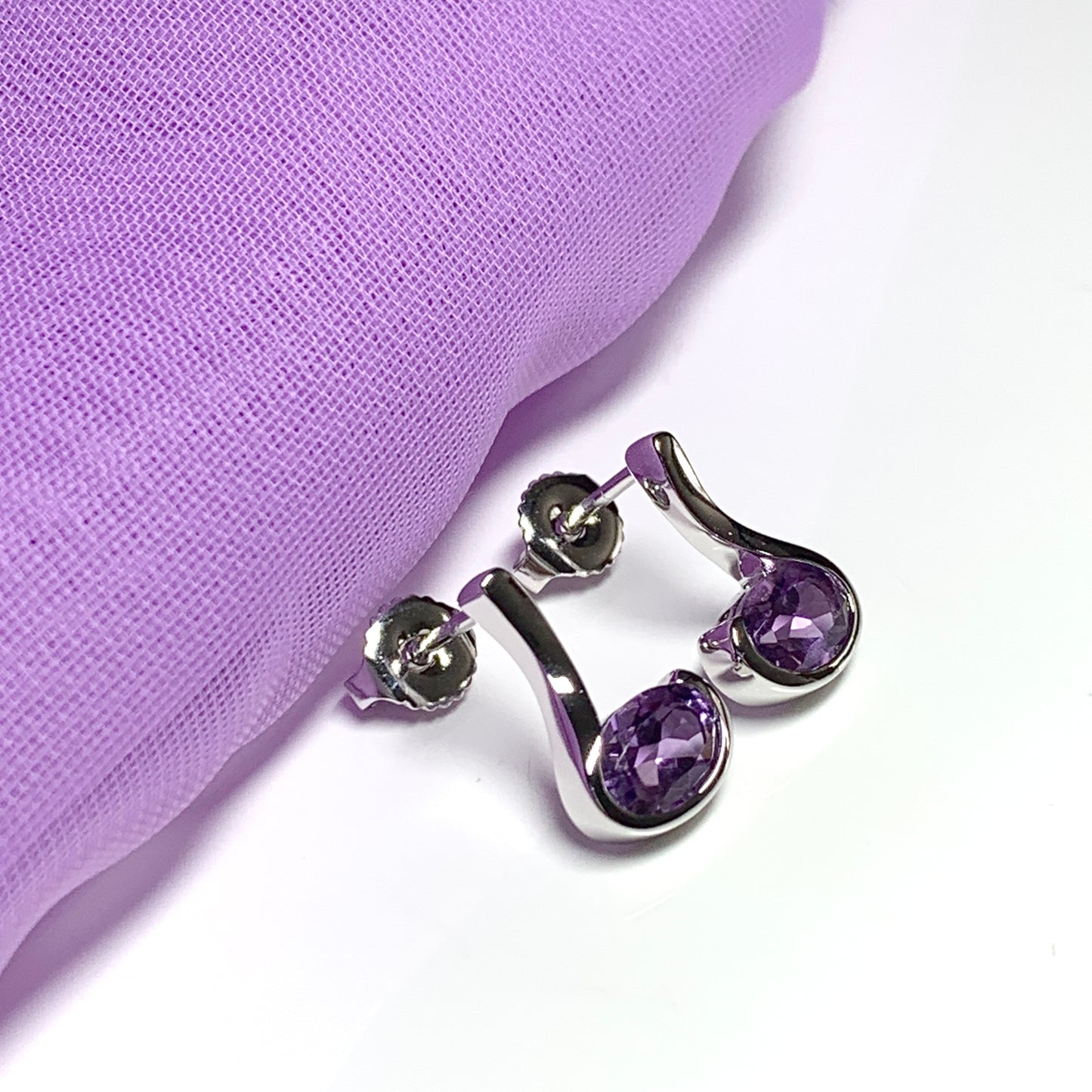 Real amethyst earrings fancy purple stud swirl