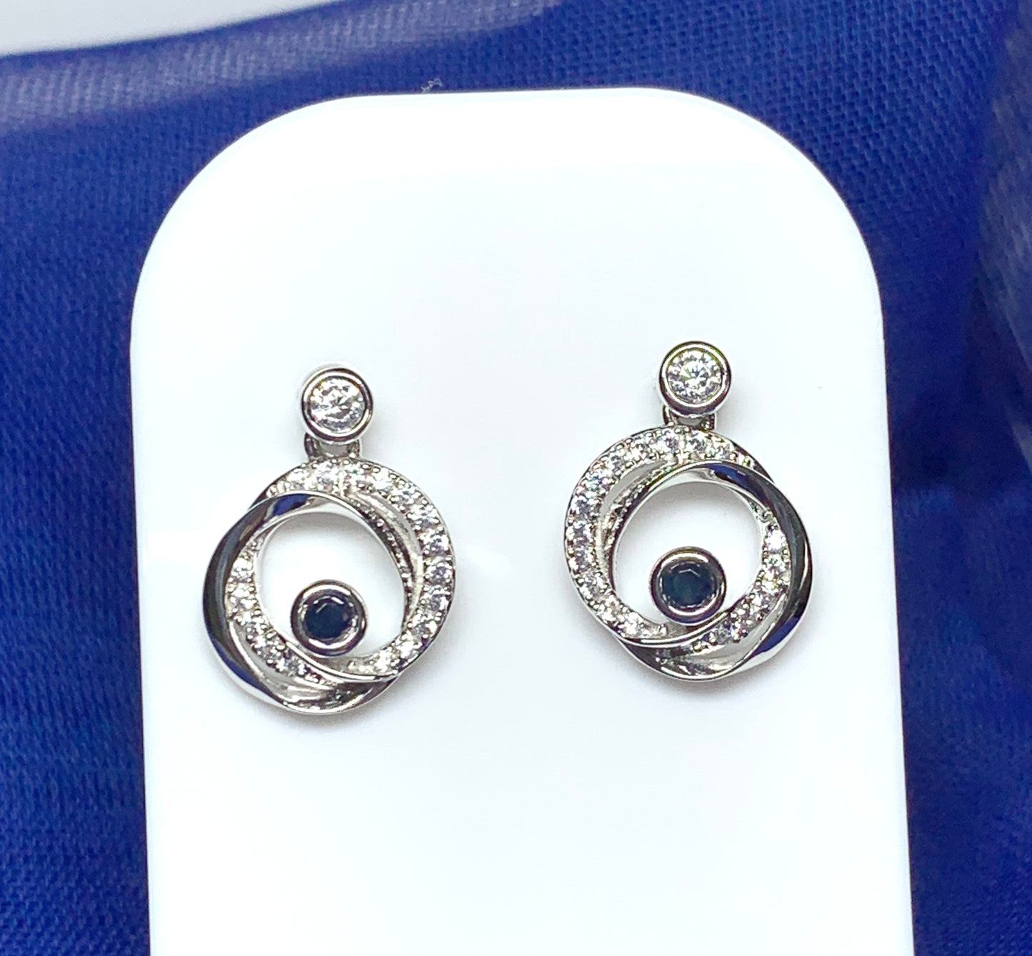 Real blue sapphire and cubic zirconia round swirl stud earrings