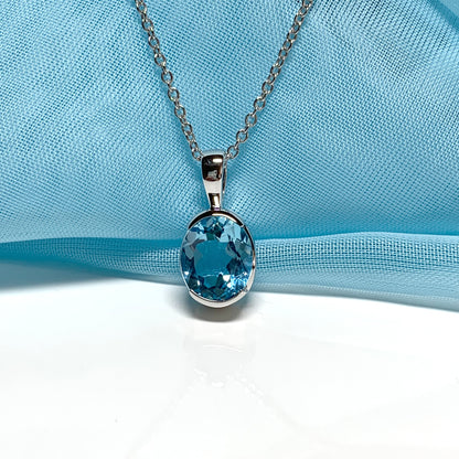 Real blue topaz necklace pendant oval smooth rubbed over setting