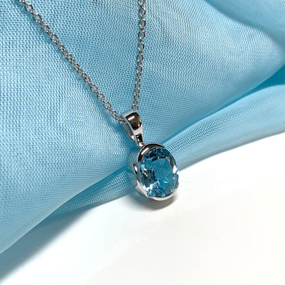 Real blue topaz necklace pendant oval smooth rubbed over setting