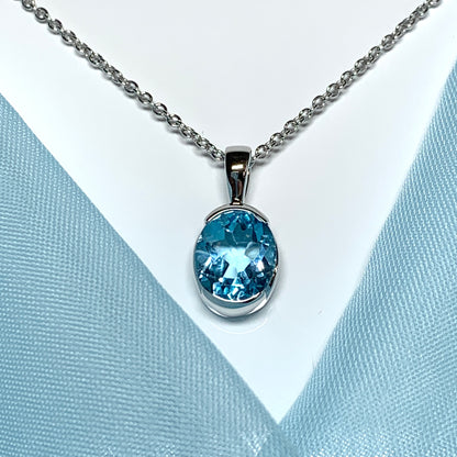 Real blue topaz necklace pendant oval smooth rubbed over setting