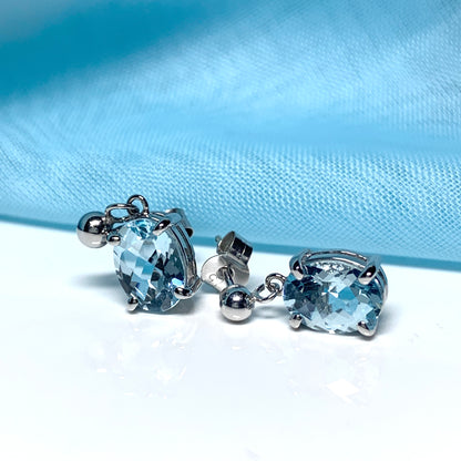 Blue topaz white gold oval drop earrings