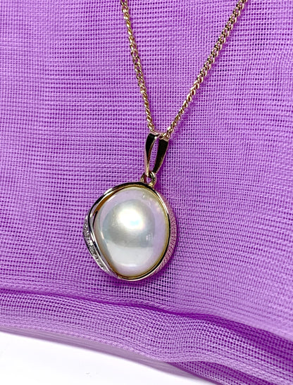 Real cultured mabe pearl and diamond pendant yellow gold