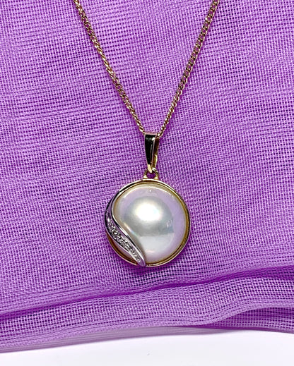 Real cultured mabe pearl and diamond pendant yellow gold