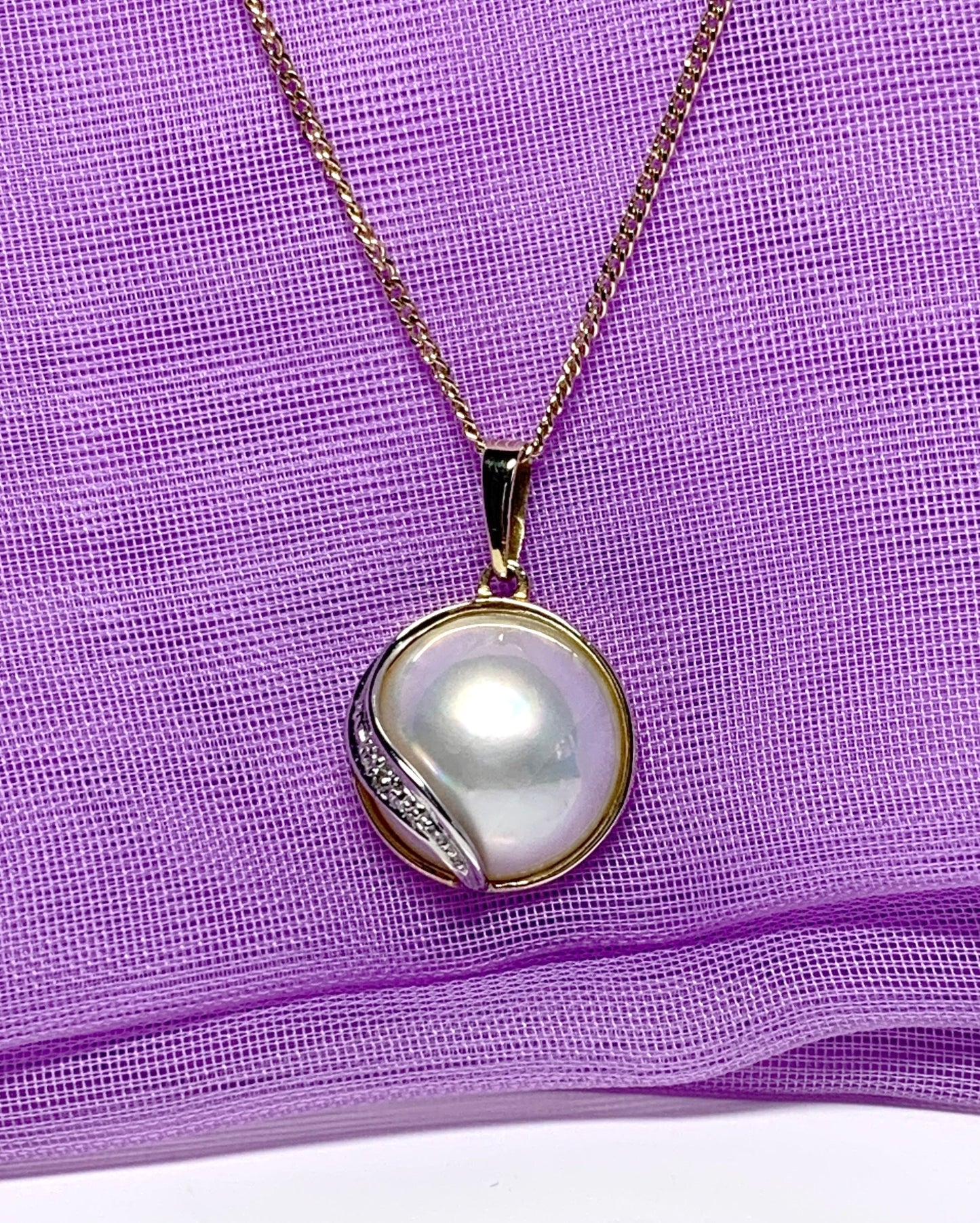 Real cultured mabe pearl and diamond pendant yellow gold