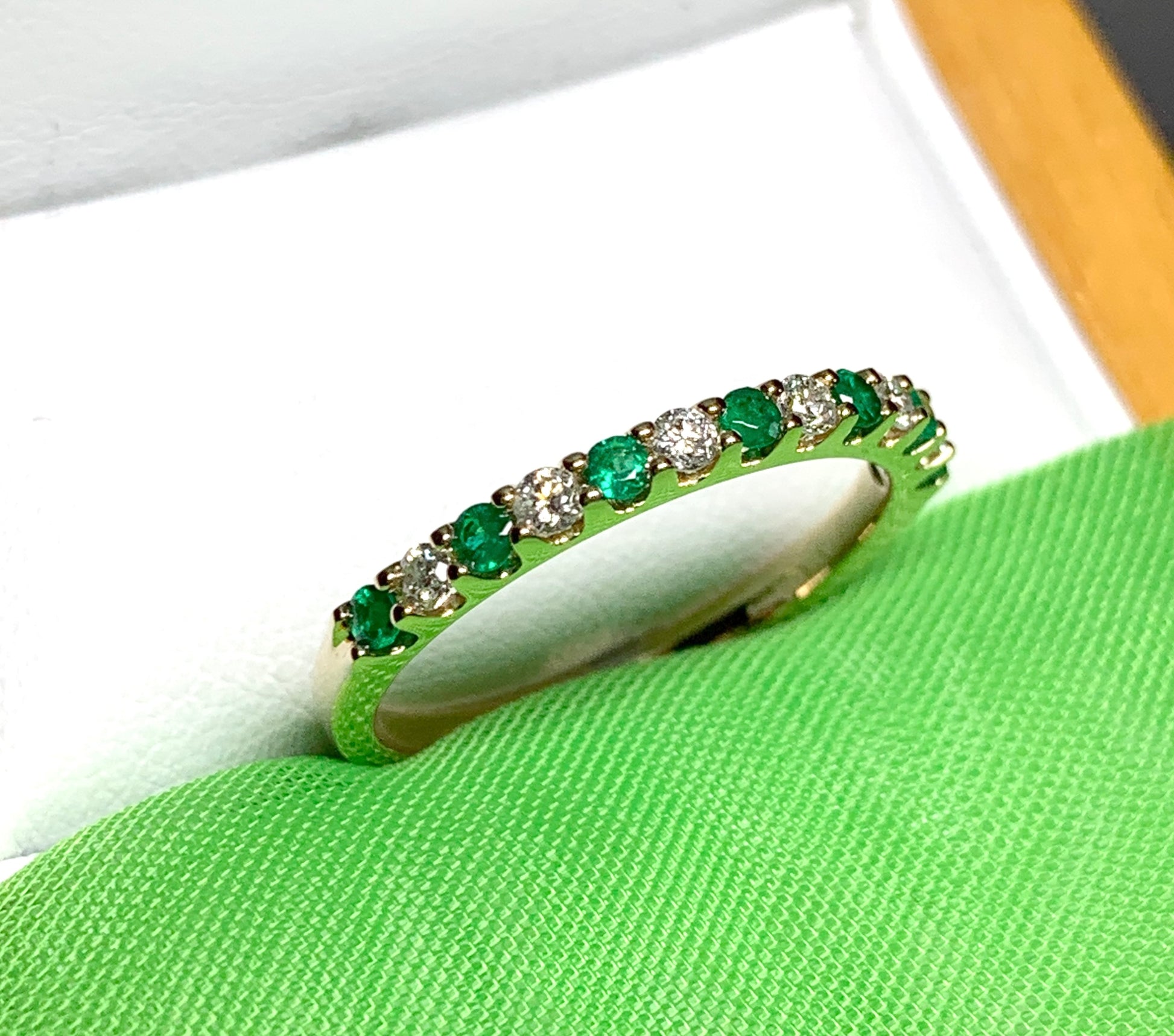 Real emerald and diamond yellow gold eternity ring