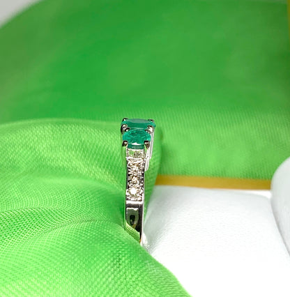 Real emerald and diamond three stone trilogy ring white gold