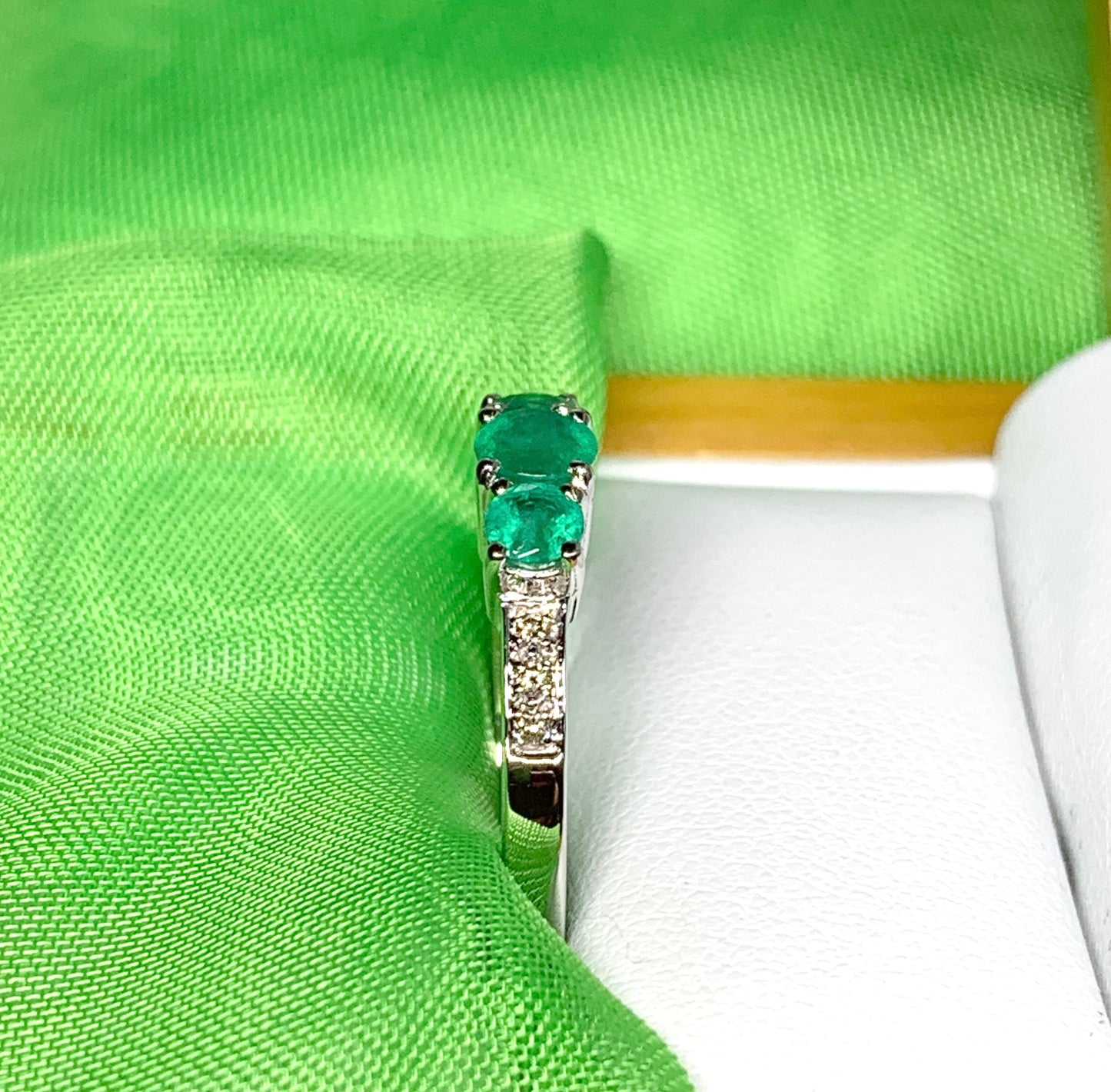 Real emerald and diamond three stone trilogy ring white gold