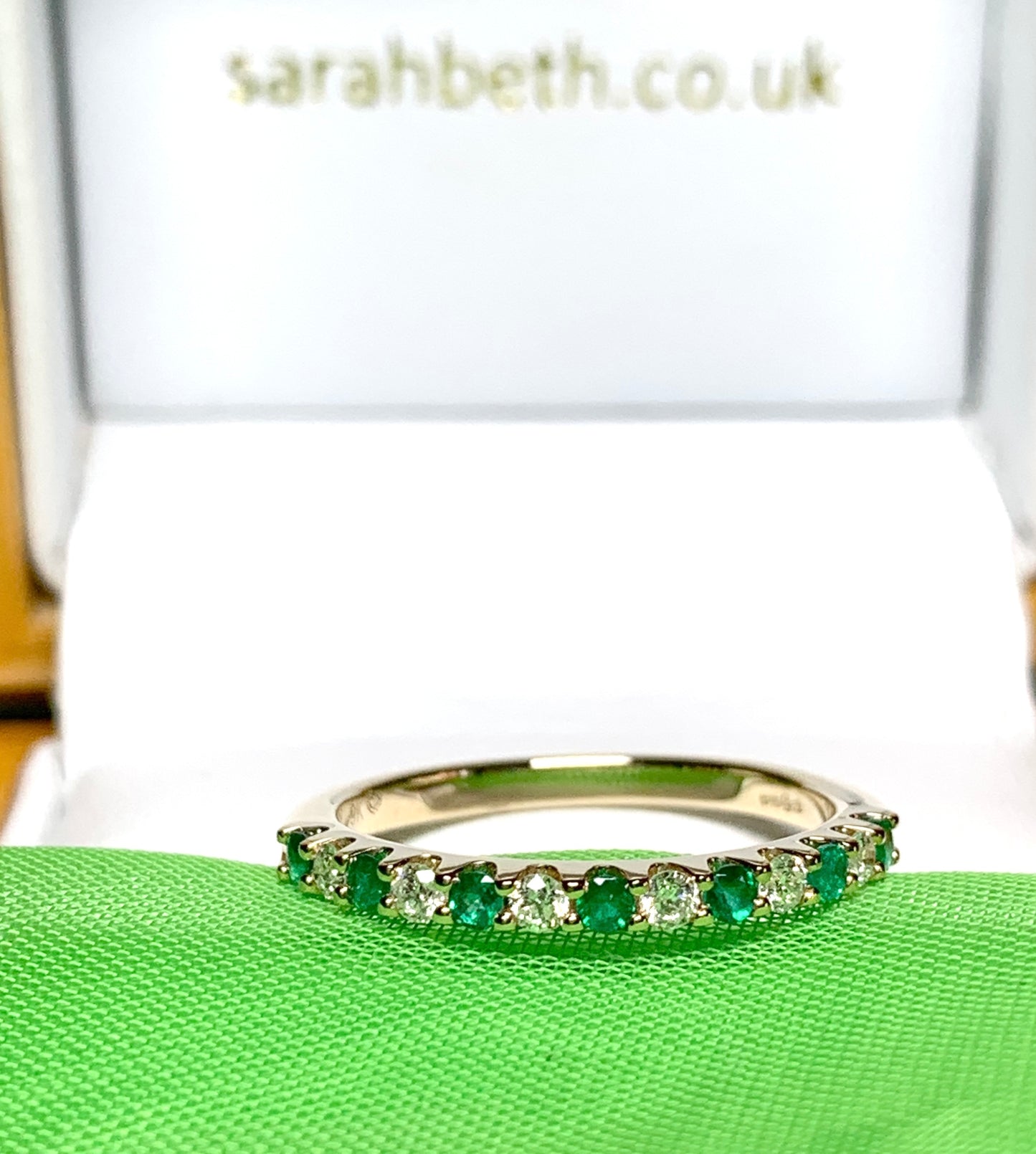 Real emerald and diamond yellow gold eternity ring