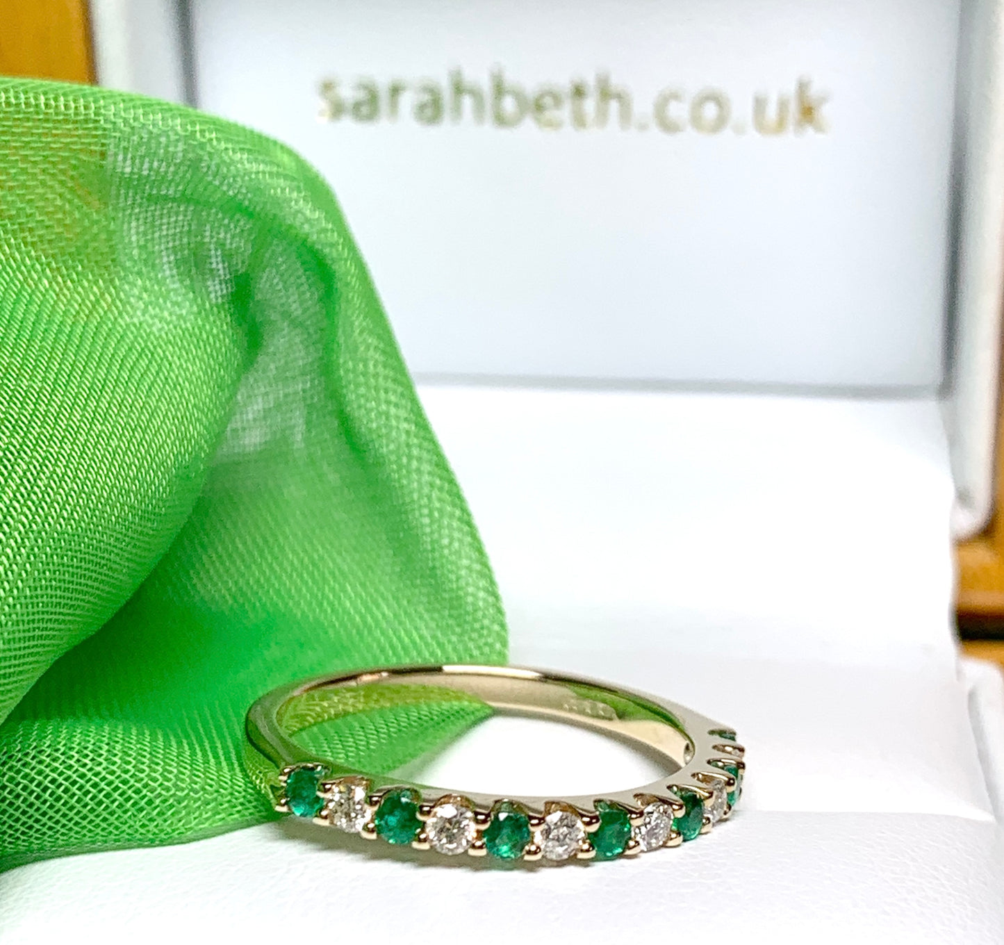 Real emerald and diamond yellow gold eternity ring