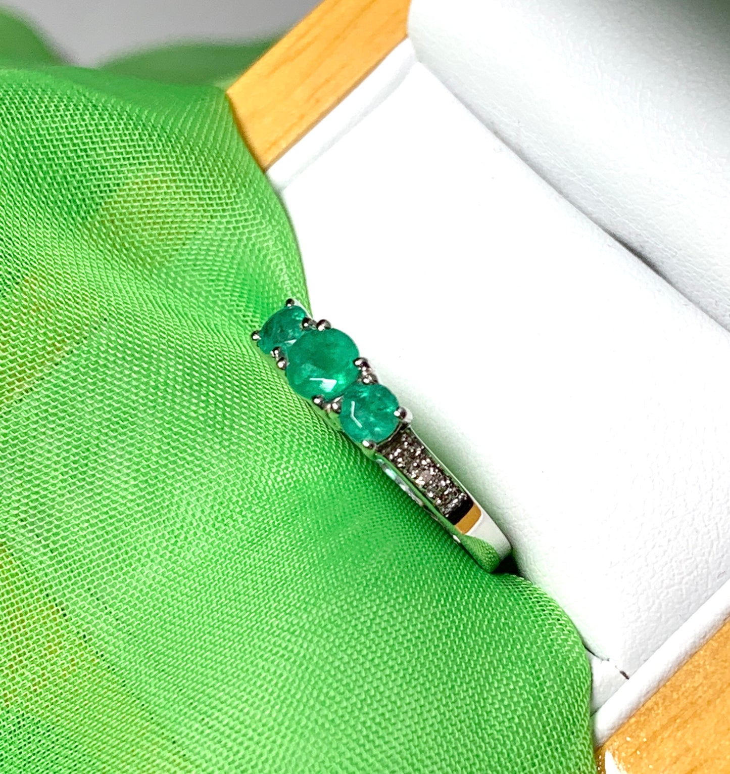 Real emerald and diamond three stone trilogy ring white gold