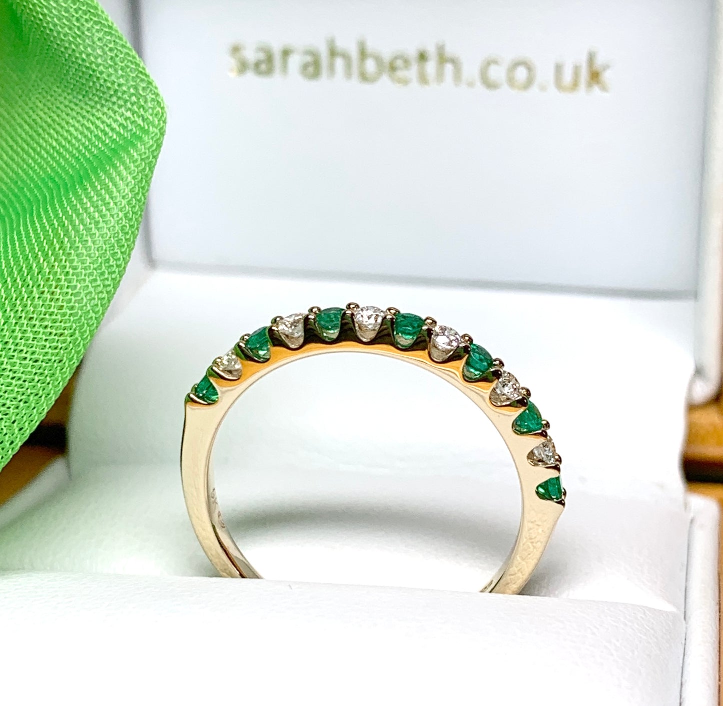 Real emerald and diamond yellow gold eternity ring