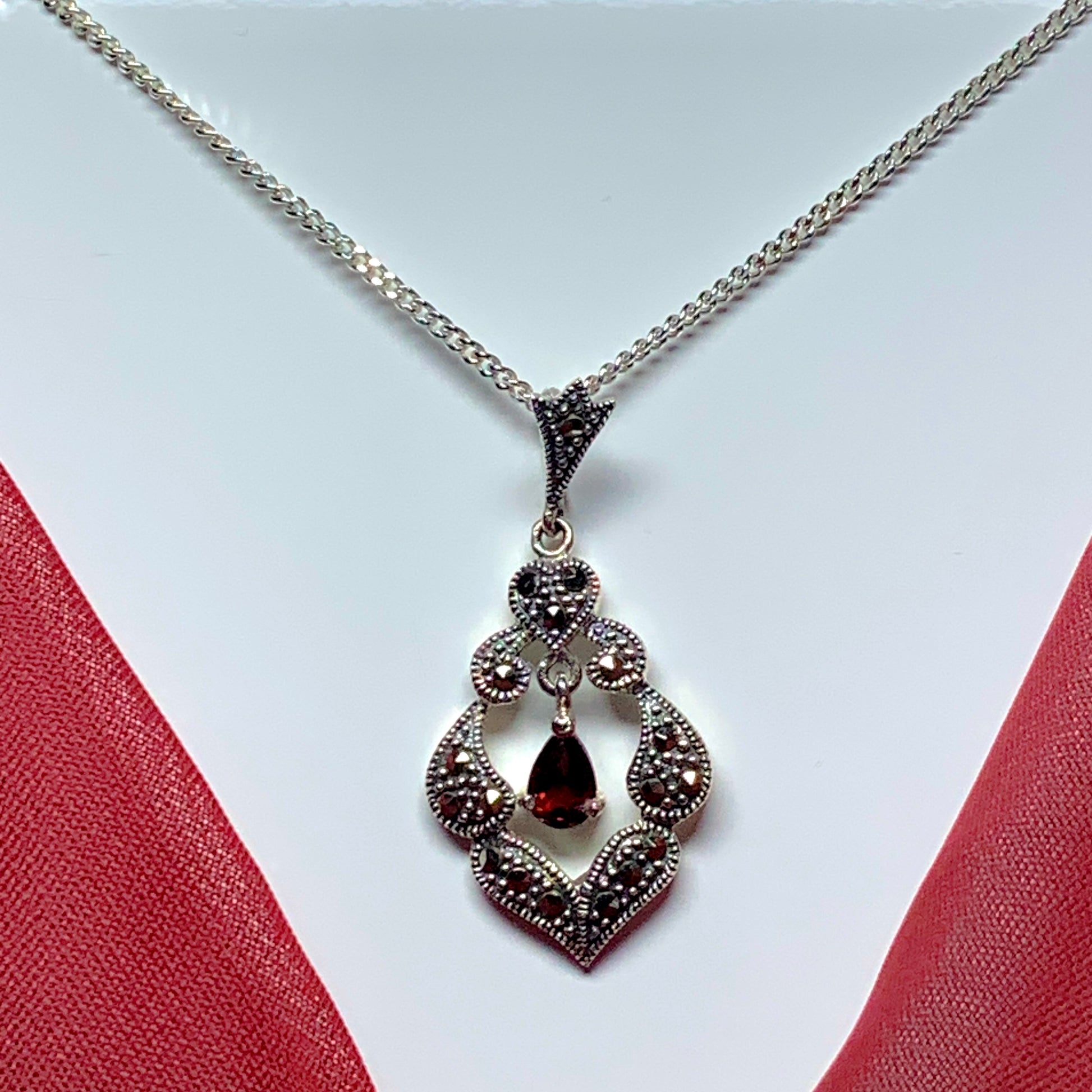 Real garnet and marcasite open pierced silver necklace