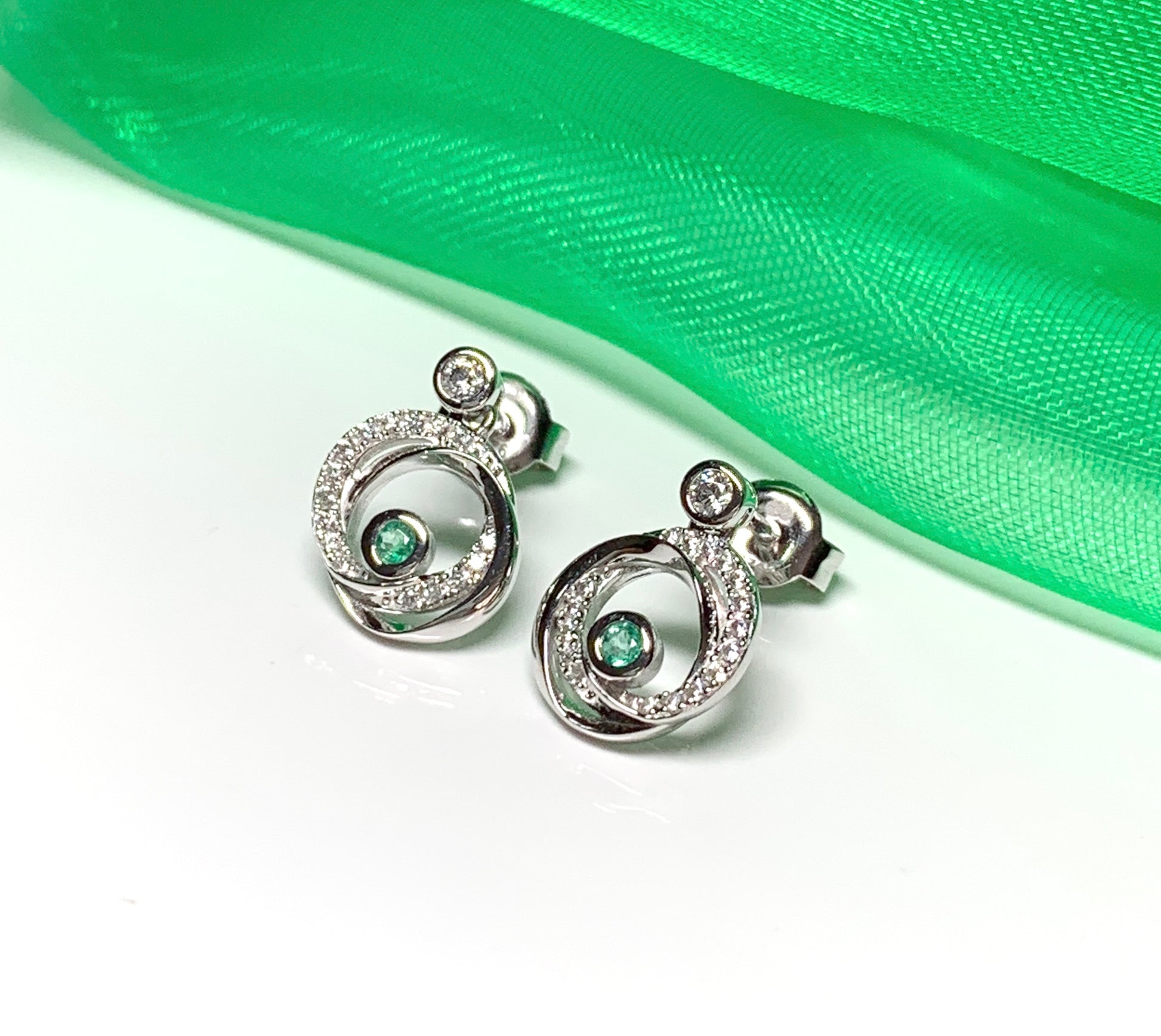 Real green emerald and cubic zirconia round swirl stud earrings