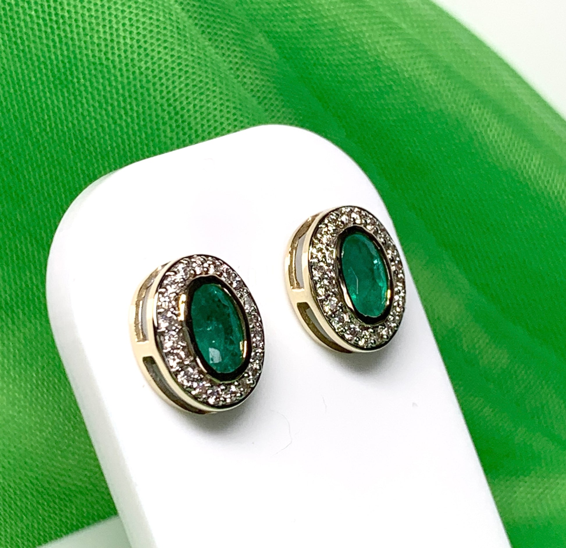 Real green emerald and diamond yellow gold oval cluster stud earrings